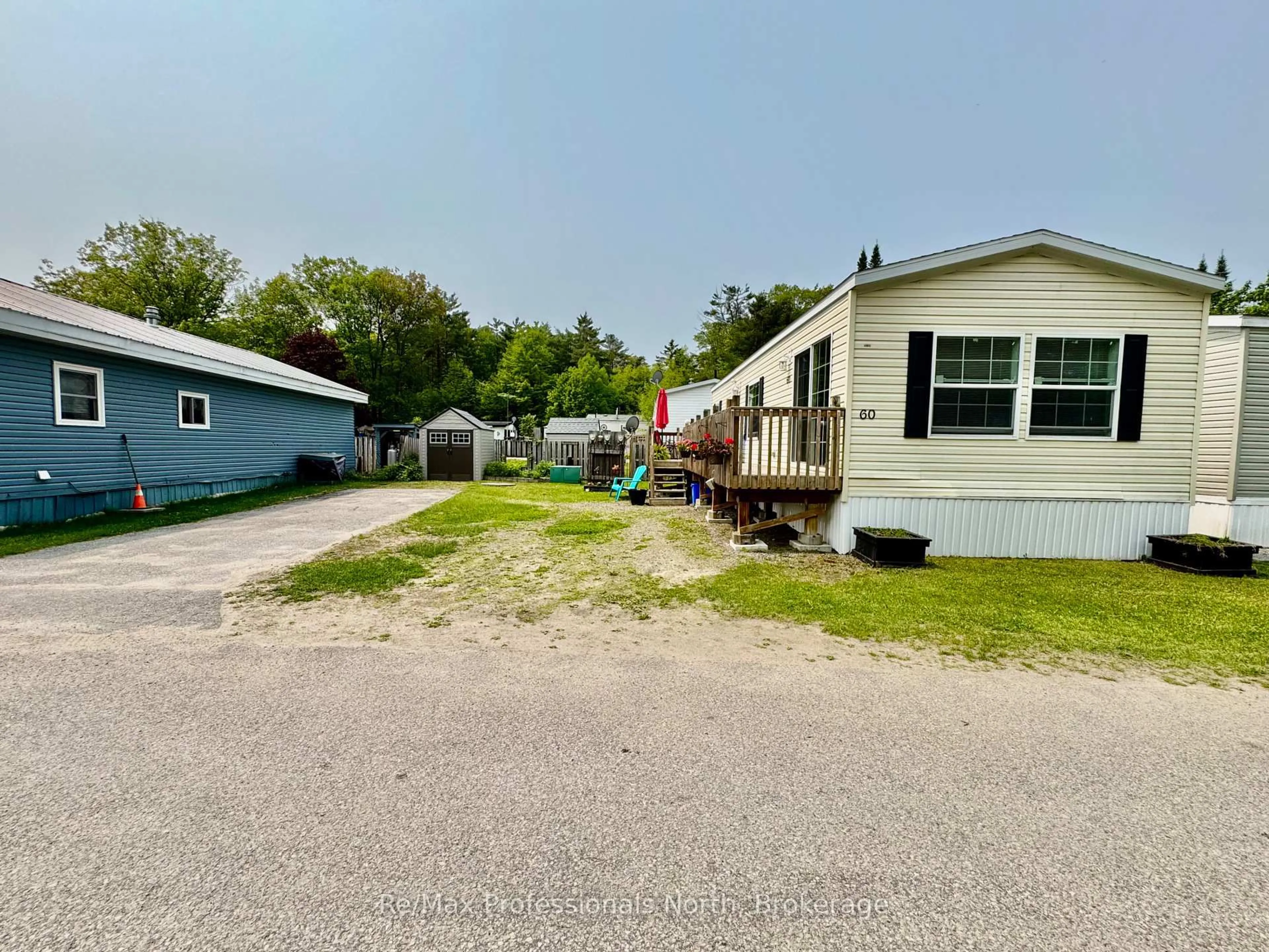 A pic from outside/outdoor area/front of a property/back of a property/a pic from drone, street for 1007 Racoon Rd #60, Gravenhurst Ontario P1P 0C3
