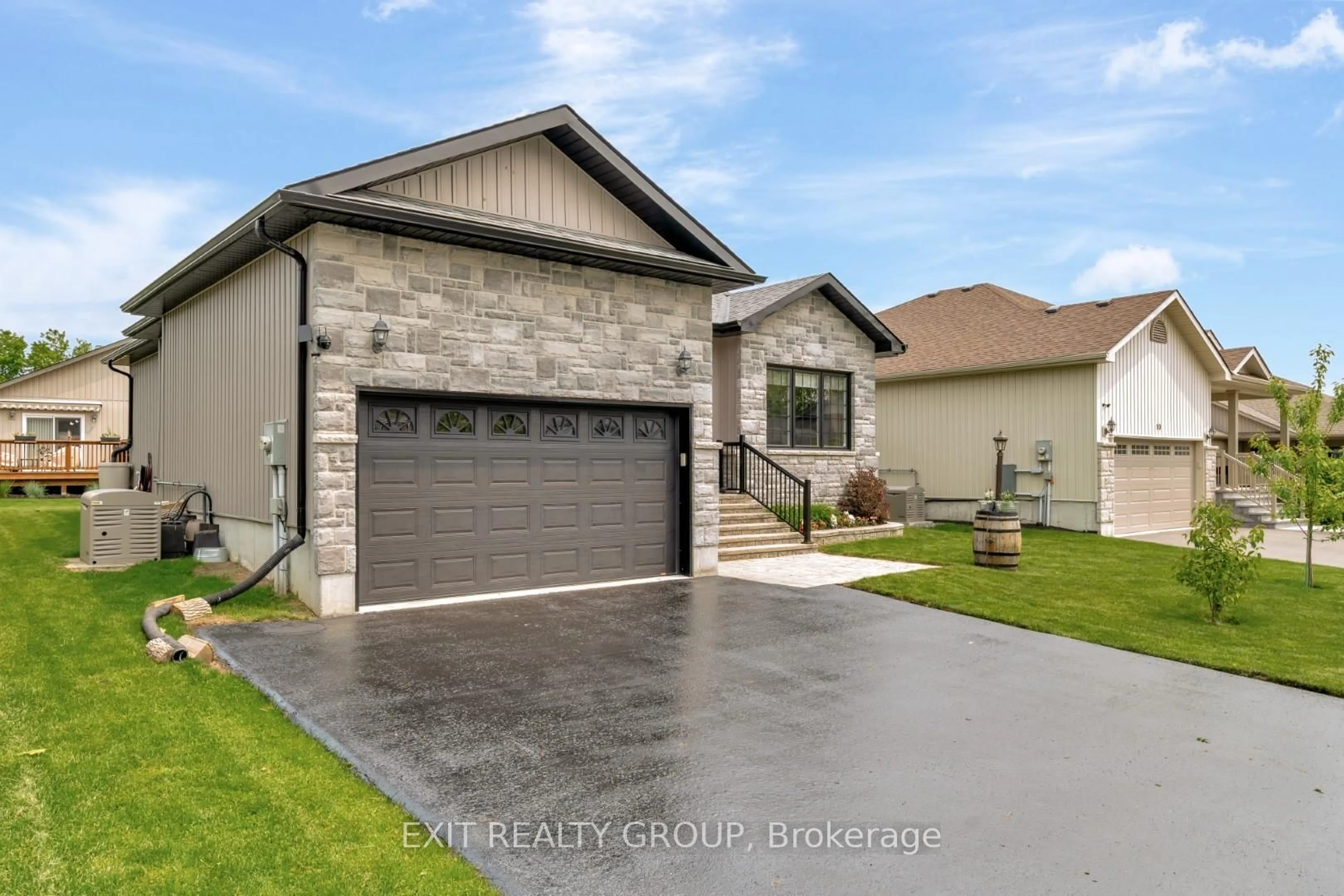Home with brick exterior material, street for 12 Conger Dr, Prince Edward County Ontario K0K 3L0