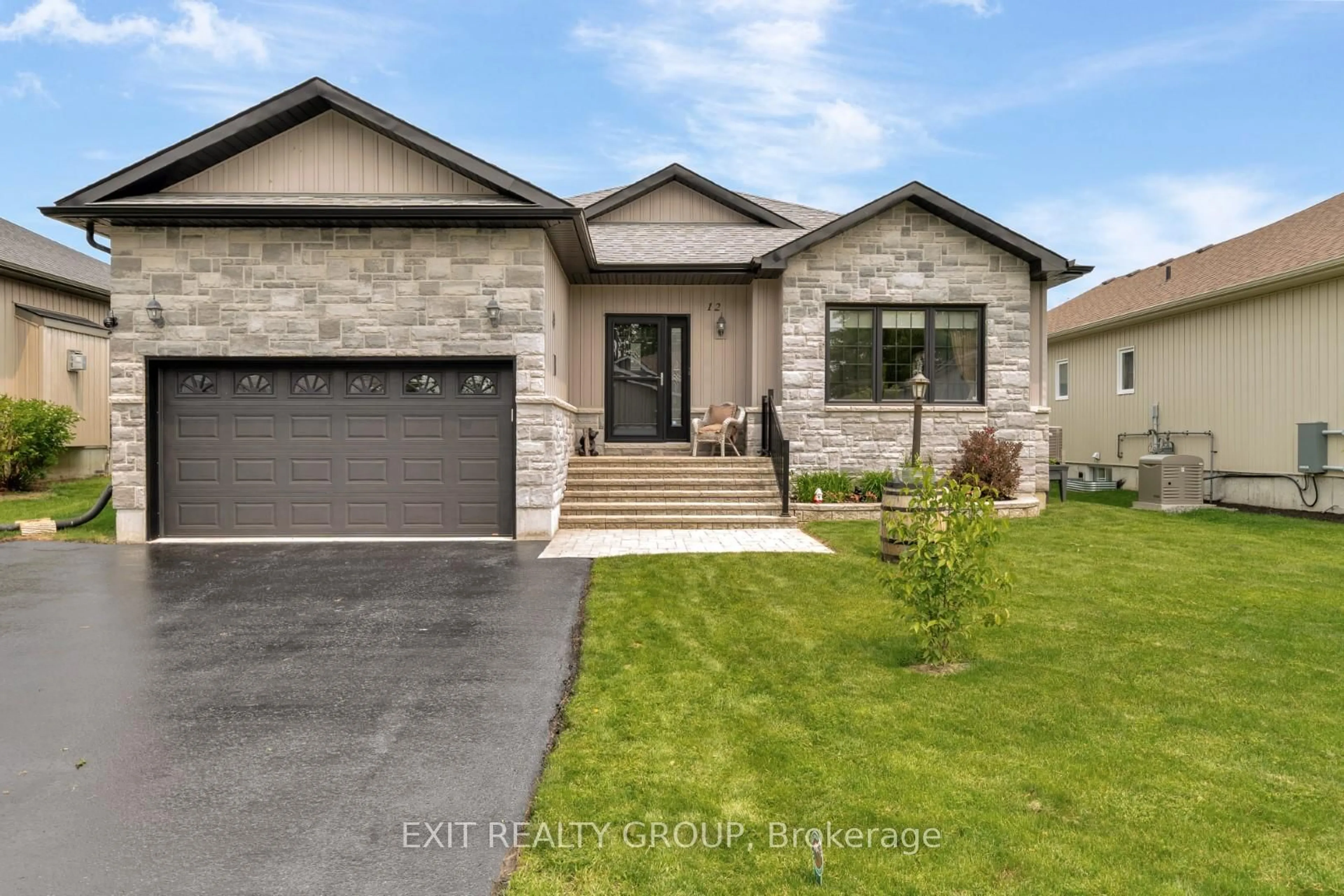 Home with brick exterior material, street for 12 Conger Dr, Prince Edward County Ontario K0K 3L0