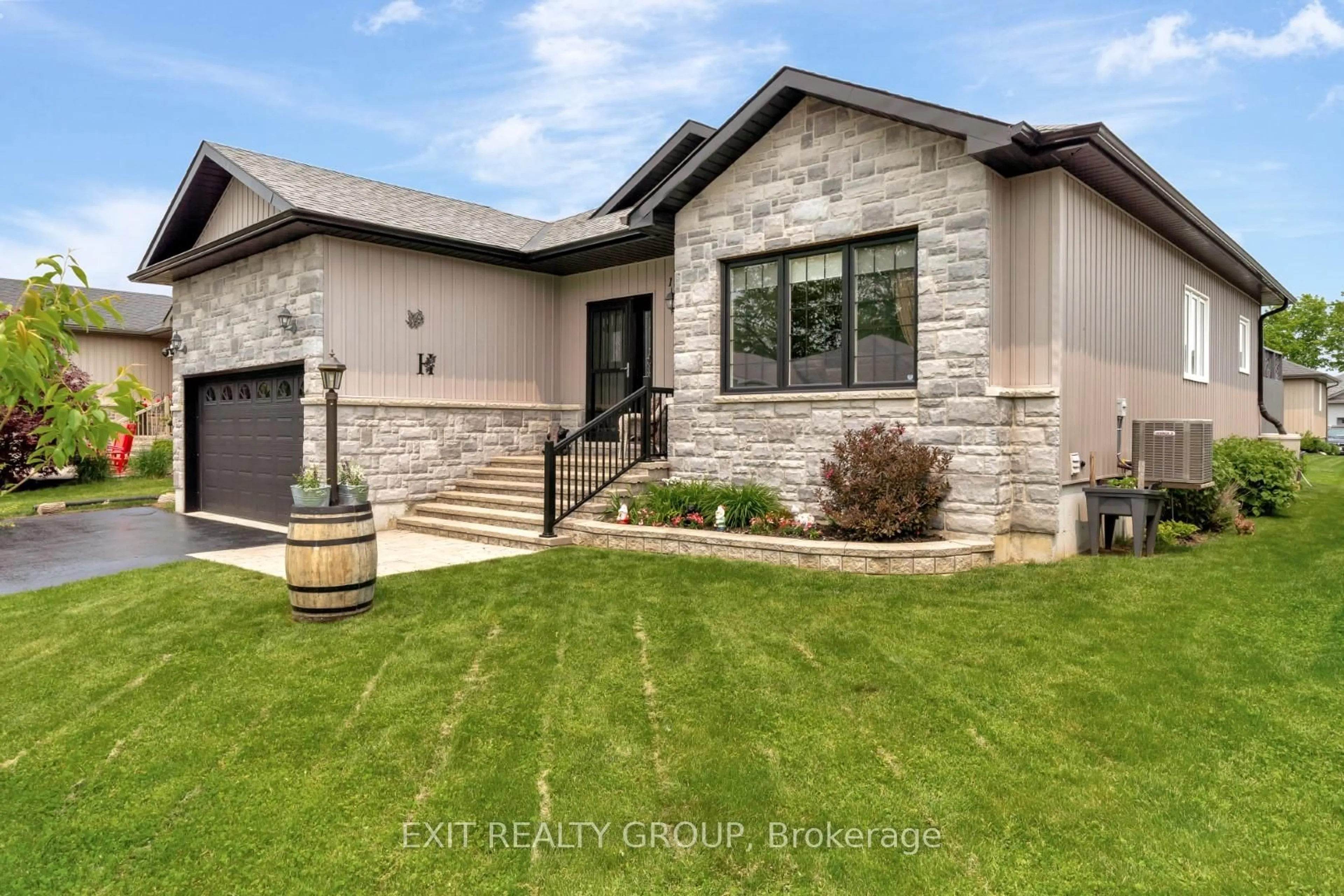Home with brick exterior material, street for 12 Conger Dr, Prince Edward County Ontario K0K 3L0
