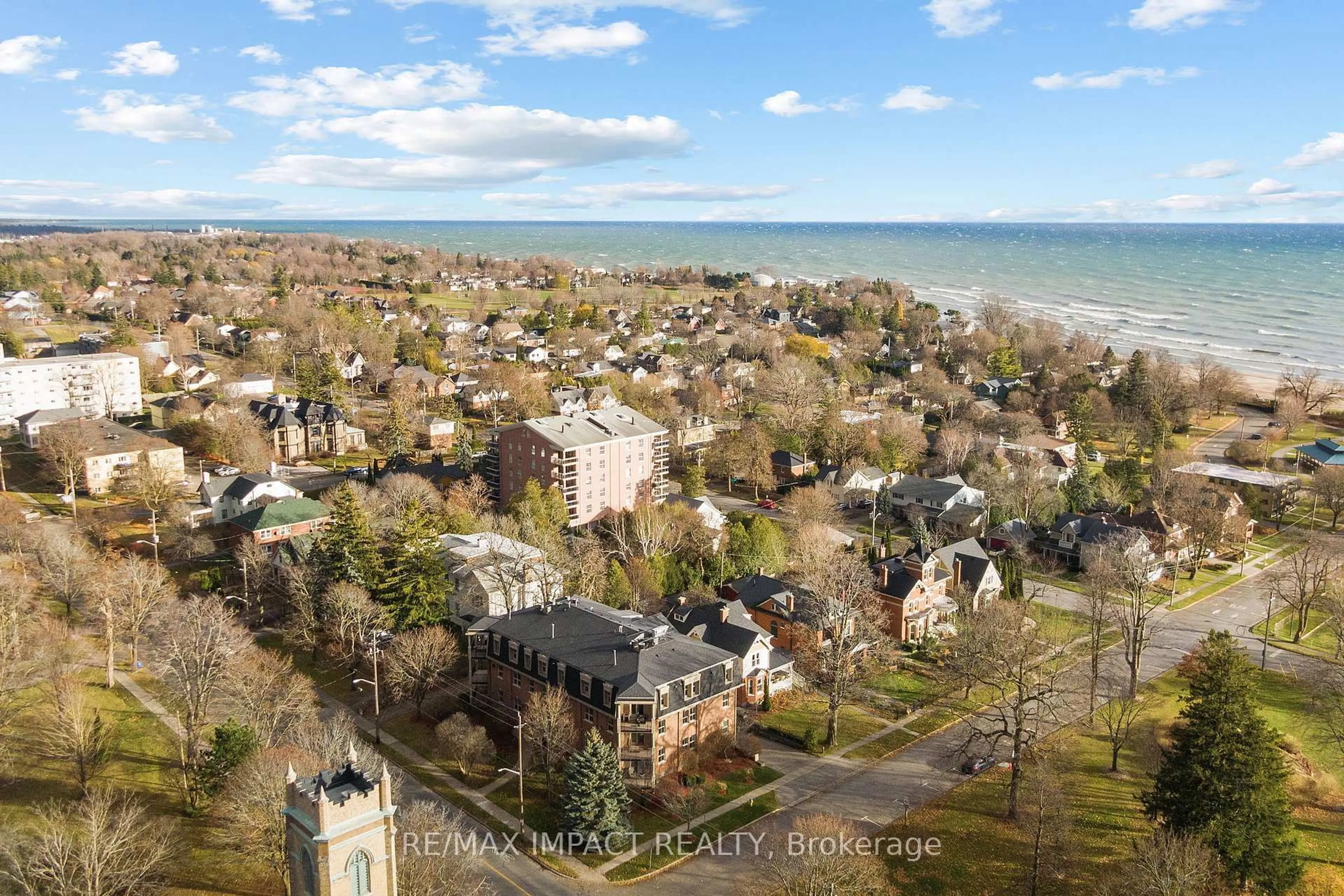 A pic from outside/outdoor area/front of a property/back of a property/a pic from drone, water/lake/river/ocean view for 220 Church St #101, Cobourg Ontario K9A 3V9