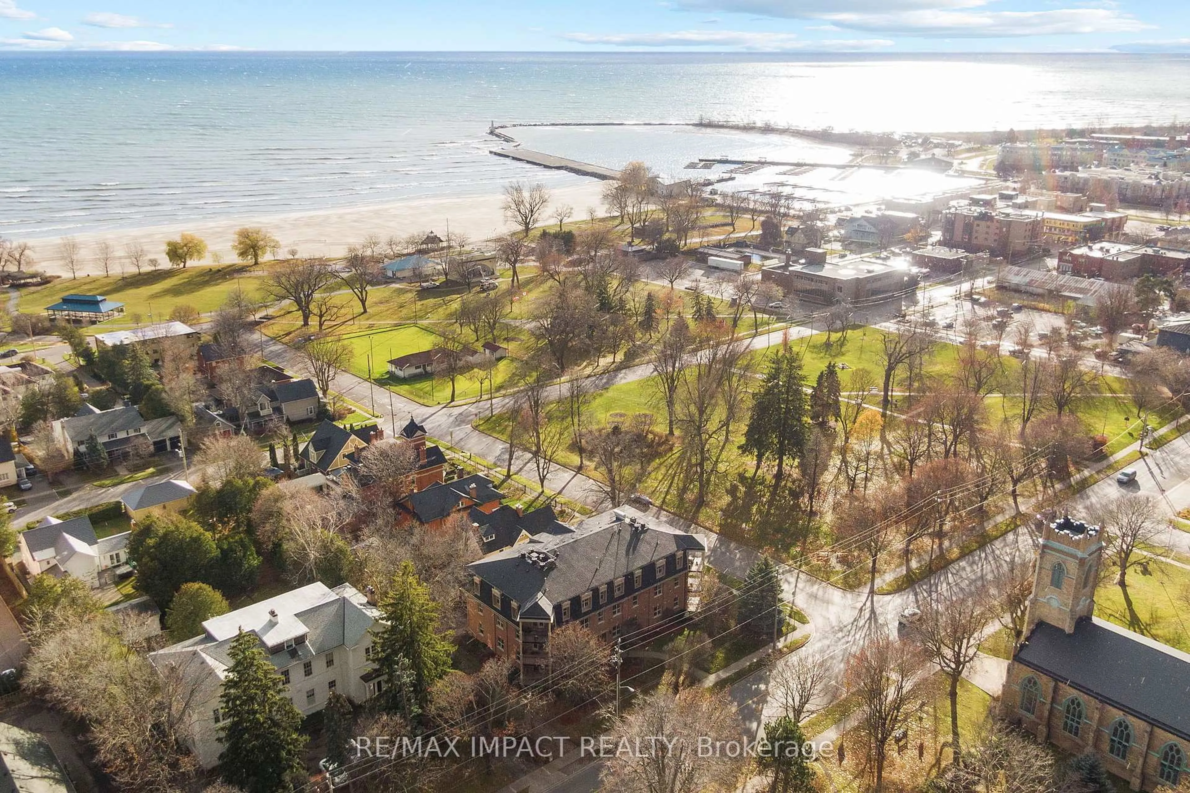A pic from outside/outdoor area/front of a property/back of a property/a pic from drone, water/lake/river/ocean view for 220 Church St #101, Cobourg Ontario K9A 3V9