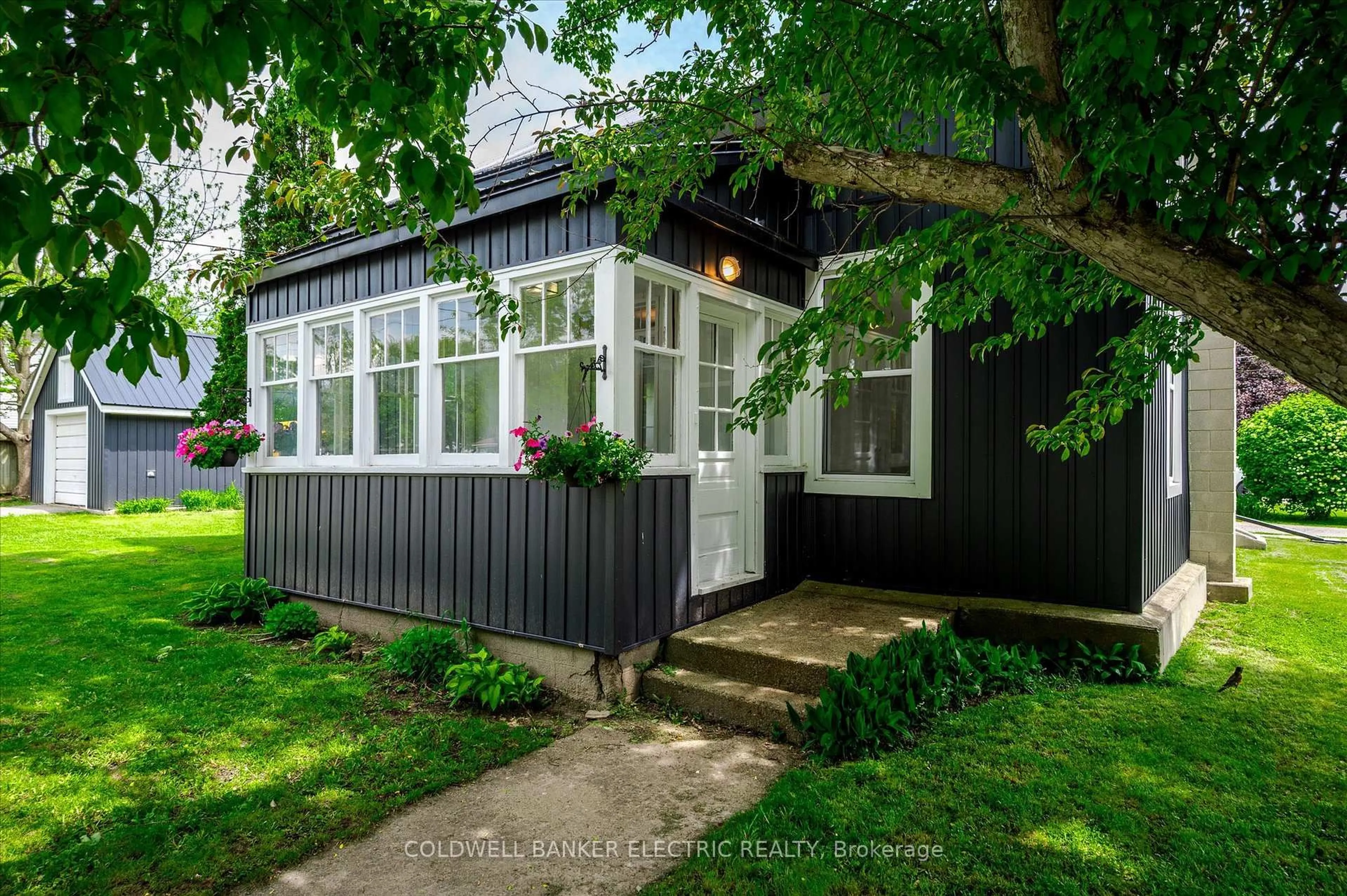Home with vinyl exterior material, street for 65 Queen St, Asphodel-Norwood Ontario K0L 2V0