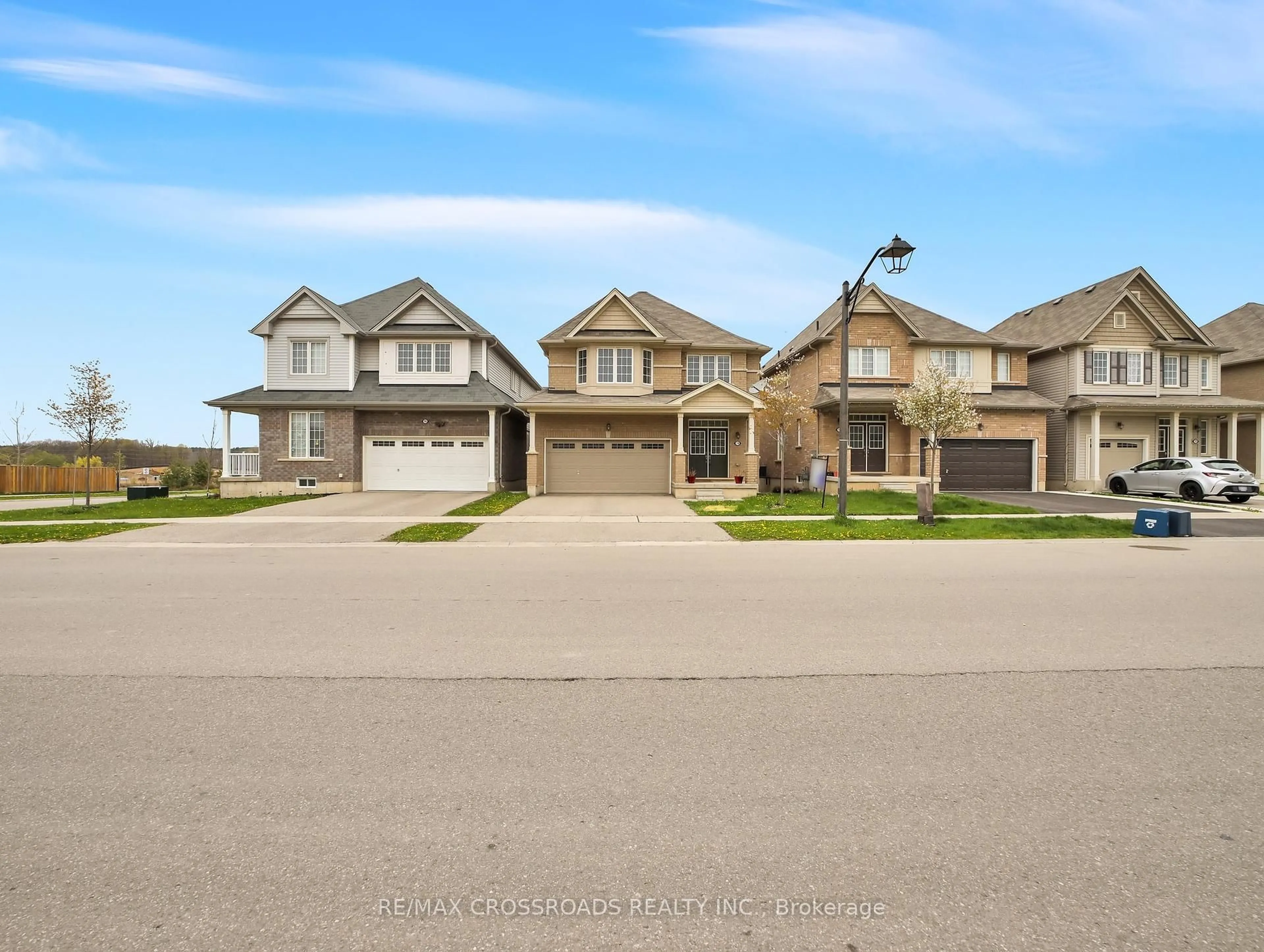 Home with vinyl exterior material, street for 74 longboat Run W Rd, Brantford Ontario N3T 5N5