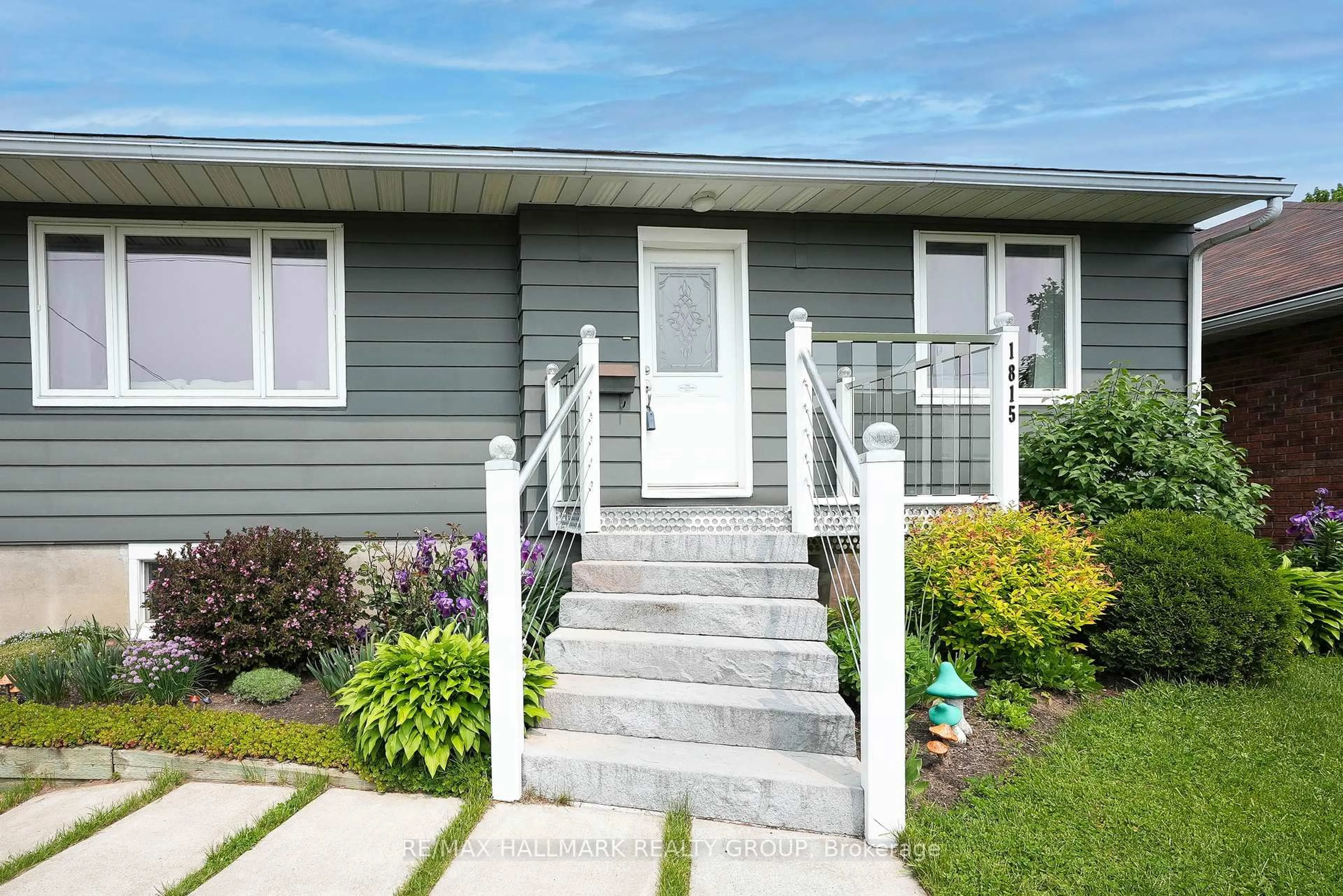 Home with vinyl exterior material, street for 1815 Kingsdale Ave, Ottawa Ontario K1T 1H7