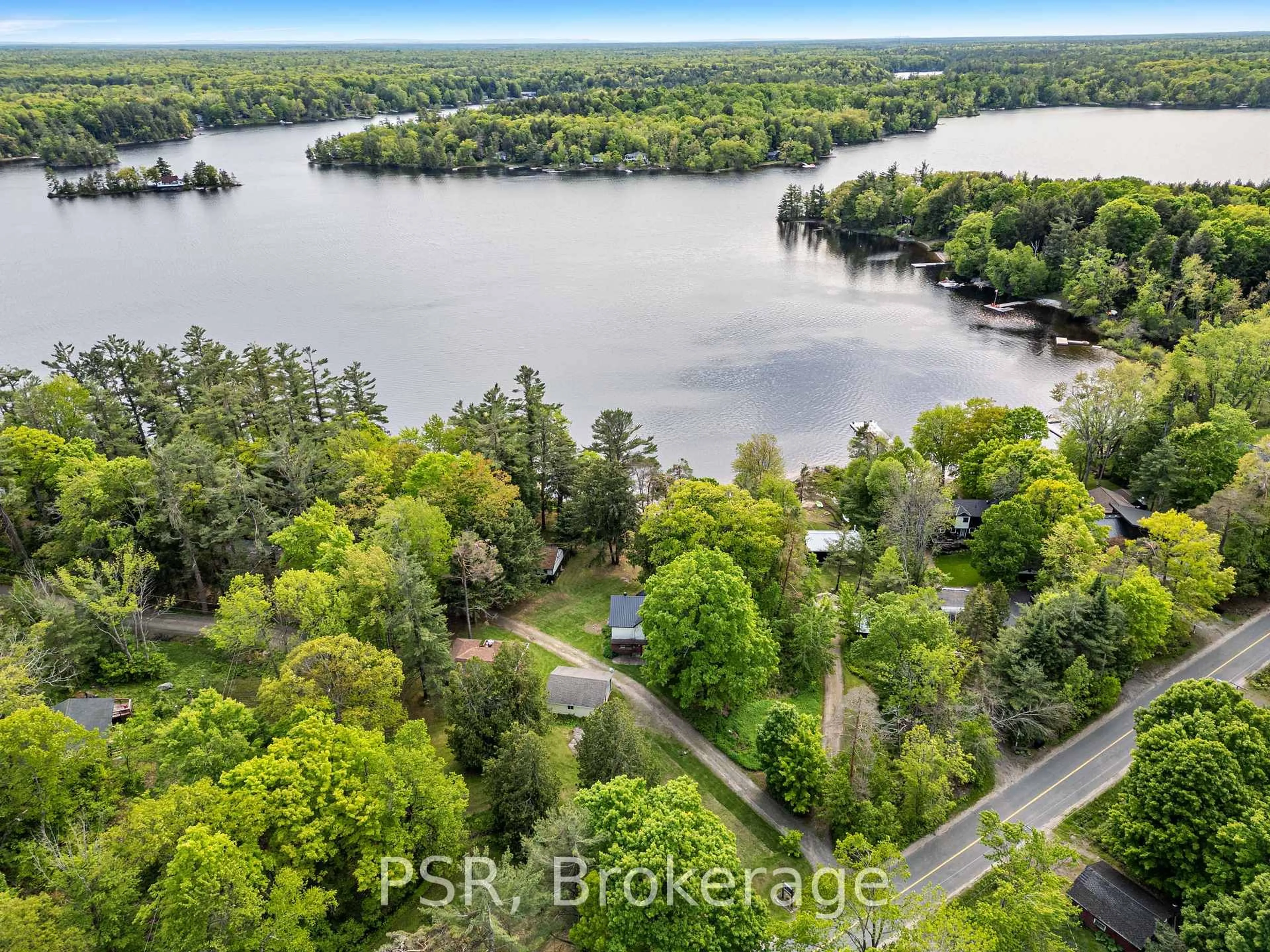 A pic from outside/outdoor area/front of a property/back of a property/a pic from drone, water/lake/river/ocean view for 1113 Moon River Rd, Muskoka Lakes Ontario P0C 1A0