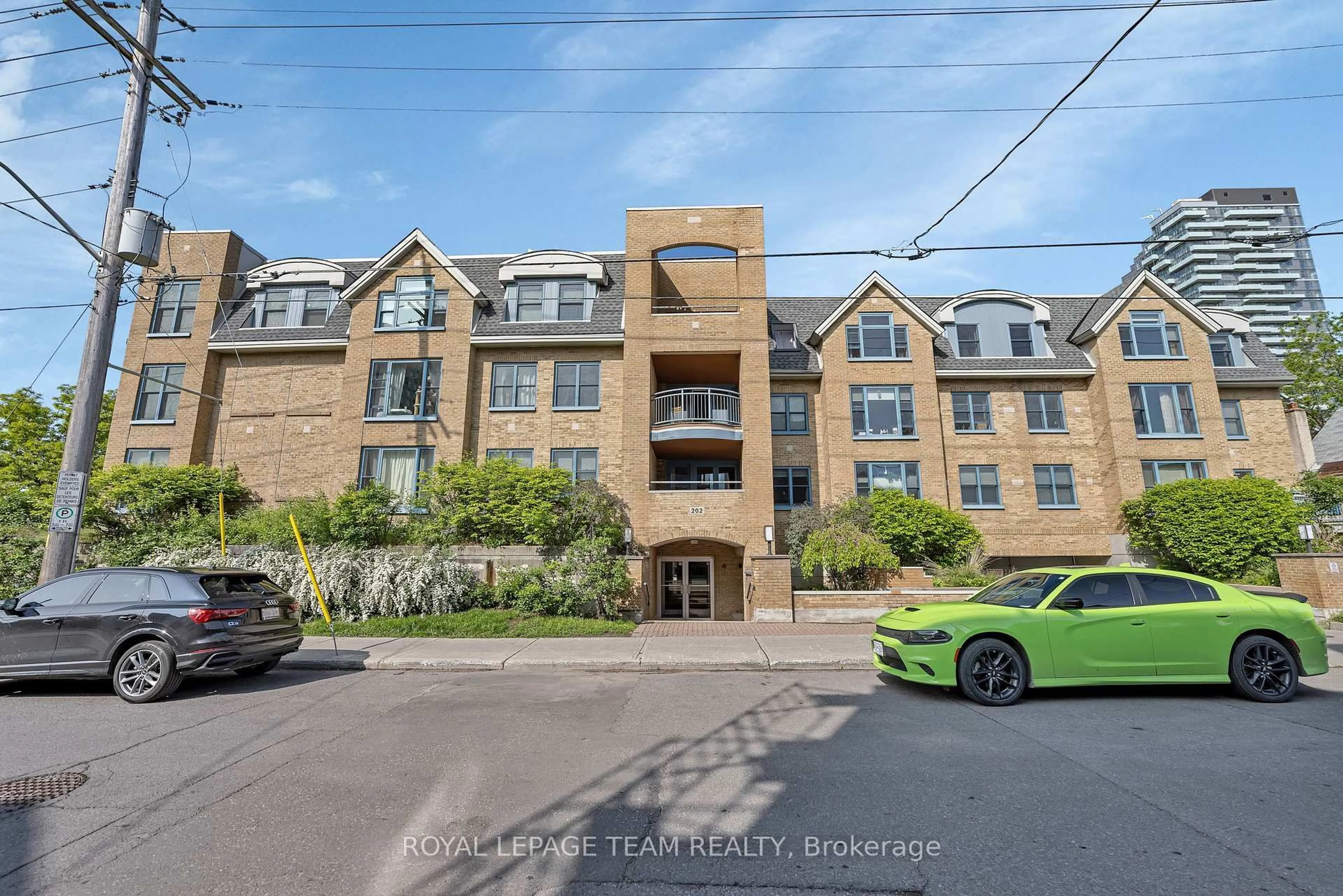 A pic from outside/outdoor area/front of a property/back of a property/a pic from drone, street for 202 Hinchey Ave #307, Ottawa Ontario K1Y 1L7