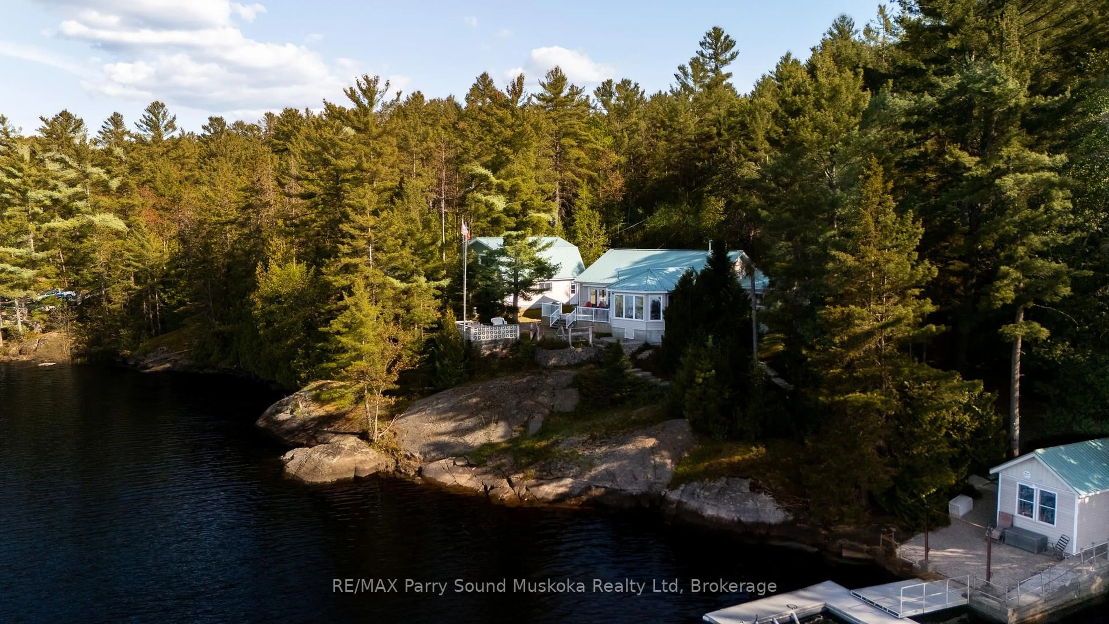 A pic from outside/outdoor area/front of a property/back of a property/a pic from drone, water/lake/river/ocean view for 667 Hwy 528A Highway, French River Ontario P0M 2K0