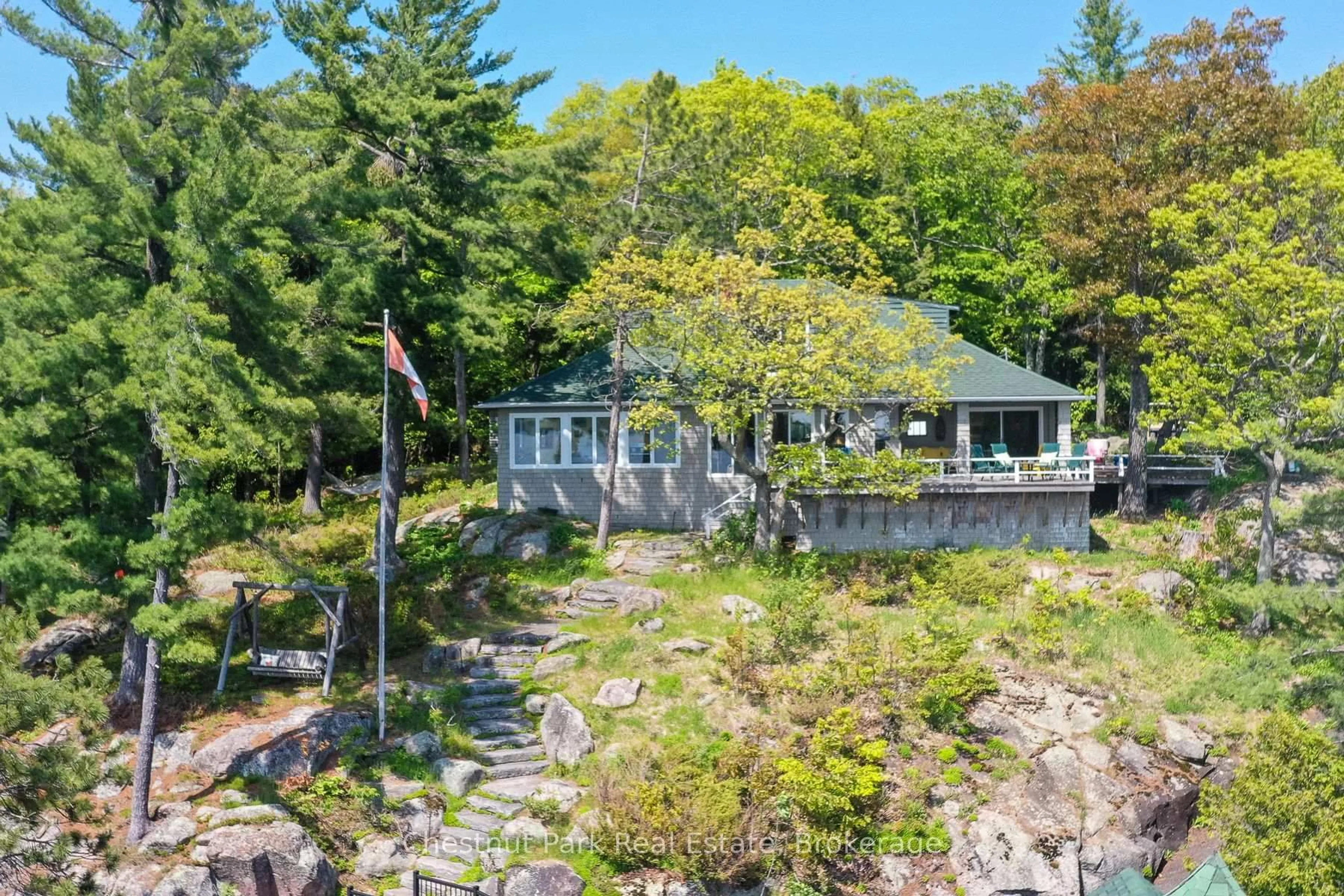 A pic from outside/outdoor area/front of a property/back of a property/a pic from drone, water/lake/river/ocean view for 1869 Muskoka 118 Rd #8, Muskoka Lakes Ontario P1L 1W8