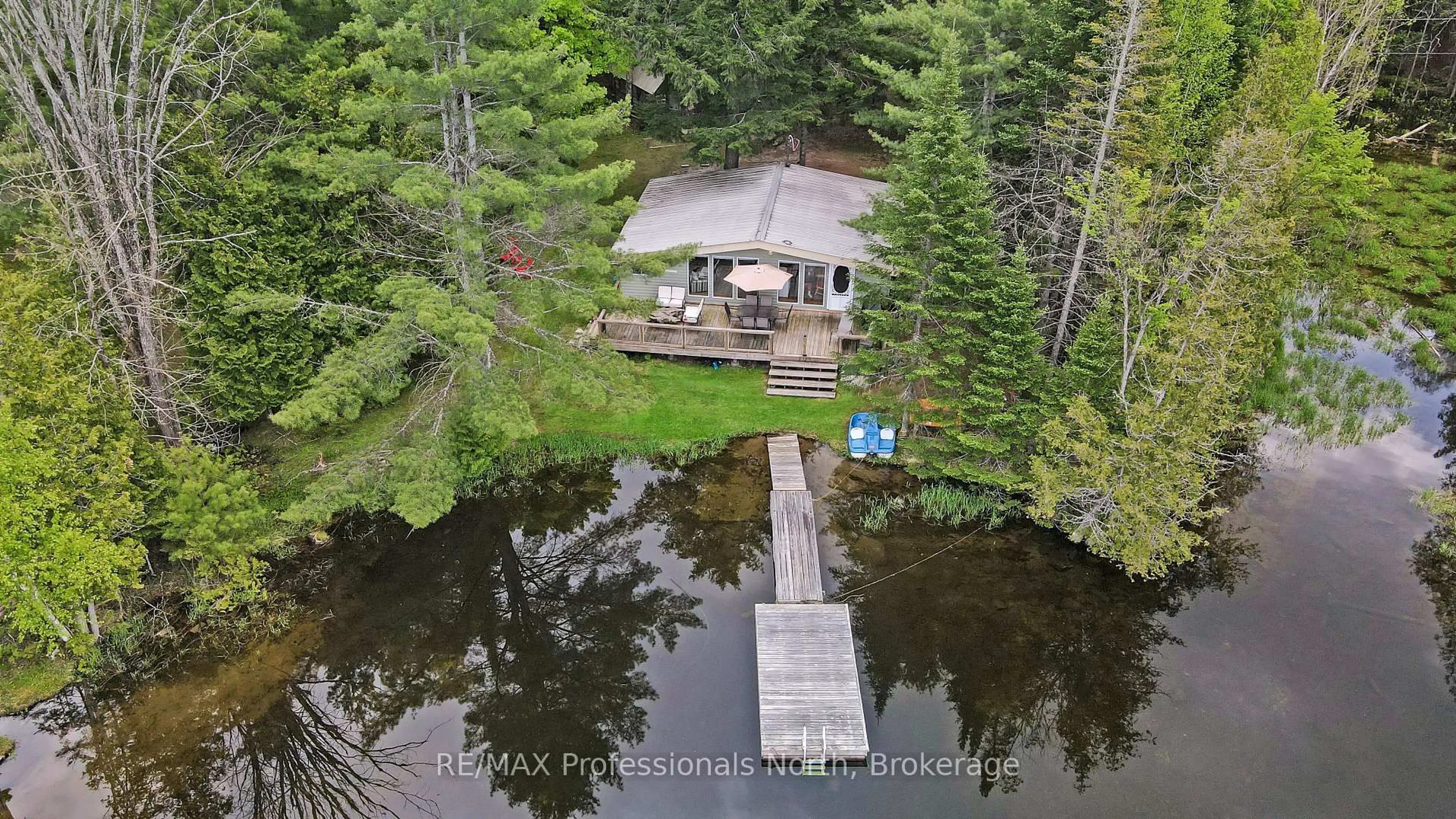A pic from outside/outdoor area/front of a property/back of a property/a pic from drone, water/lake/river/ocean view for 1056 Kodiak Tr, Highlands East Ontario K0M 1R0