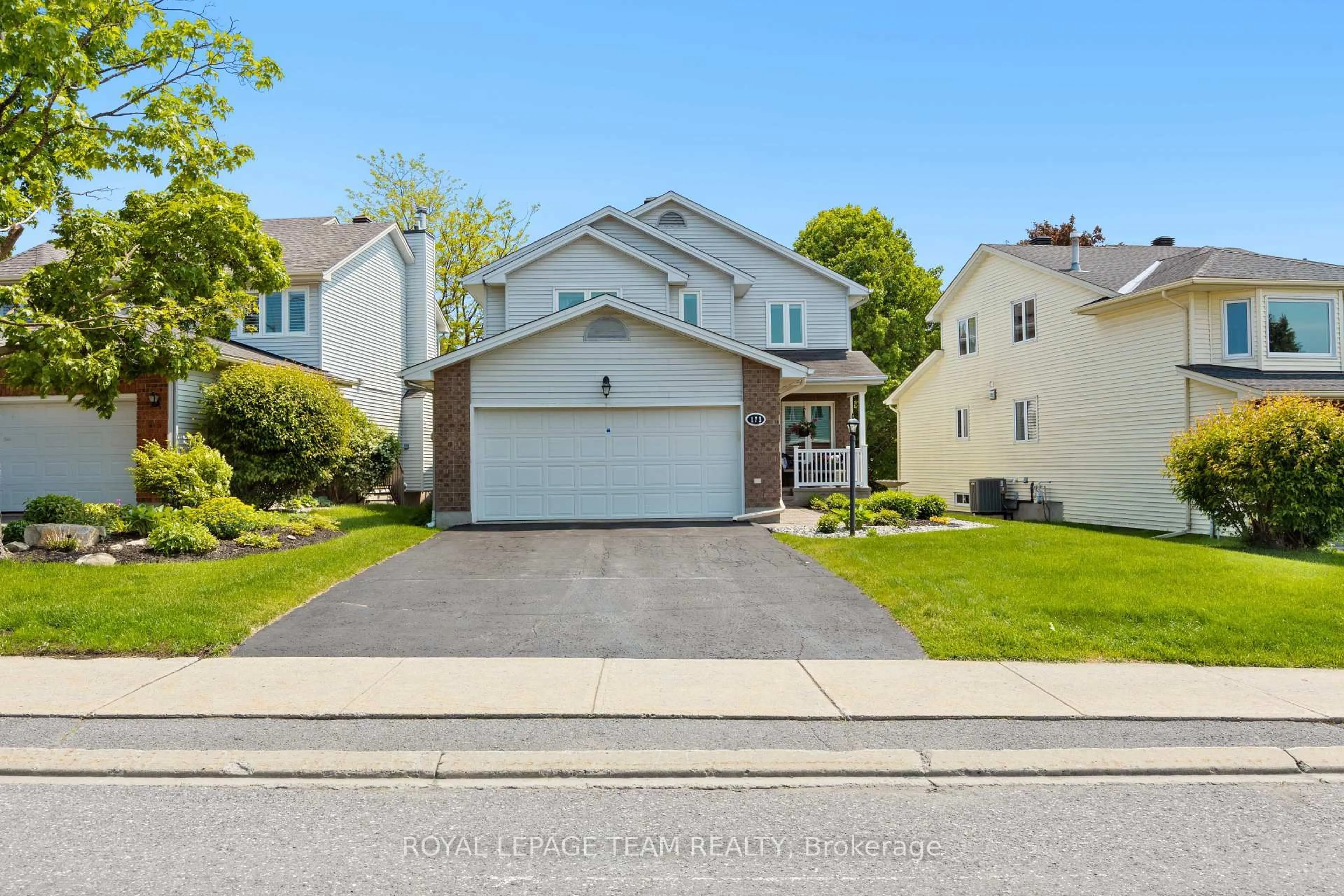 Home with vinyl exterior material, street for 173 Equestrian Dr, Ottawa Ontario K2M 2C2