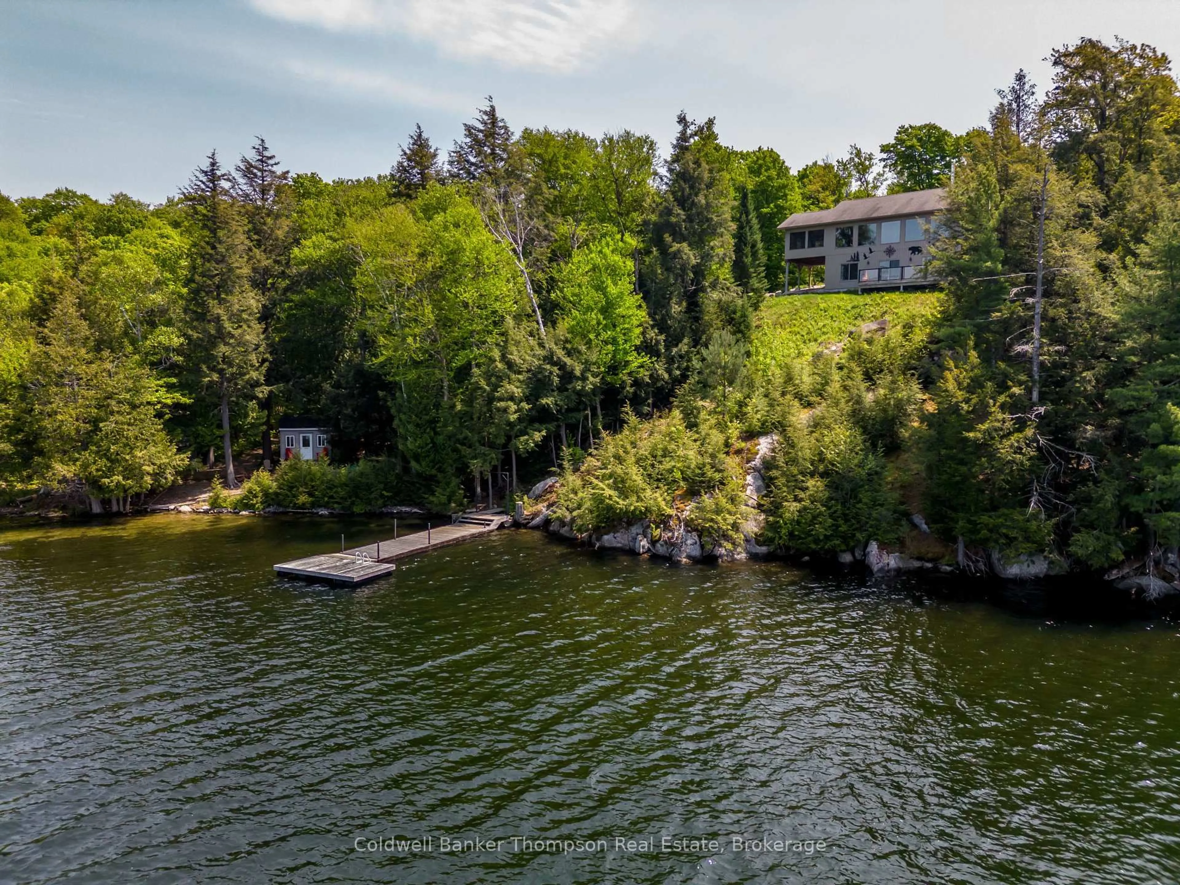 A pic from outside/outdoor area/front of a property/back of a property/a pic from drone, water/lake/river/ocean view for 1761 South Horn Lake Rd, Magnetawan Ontario P0A 1C0