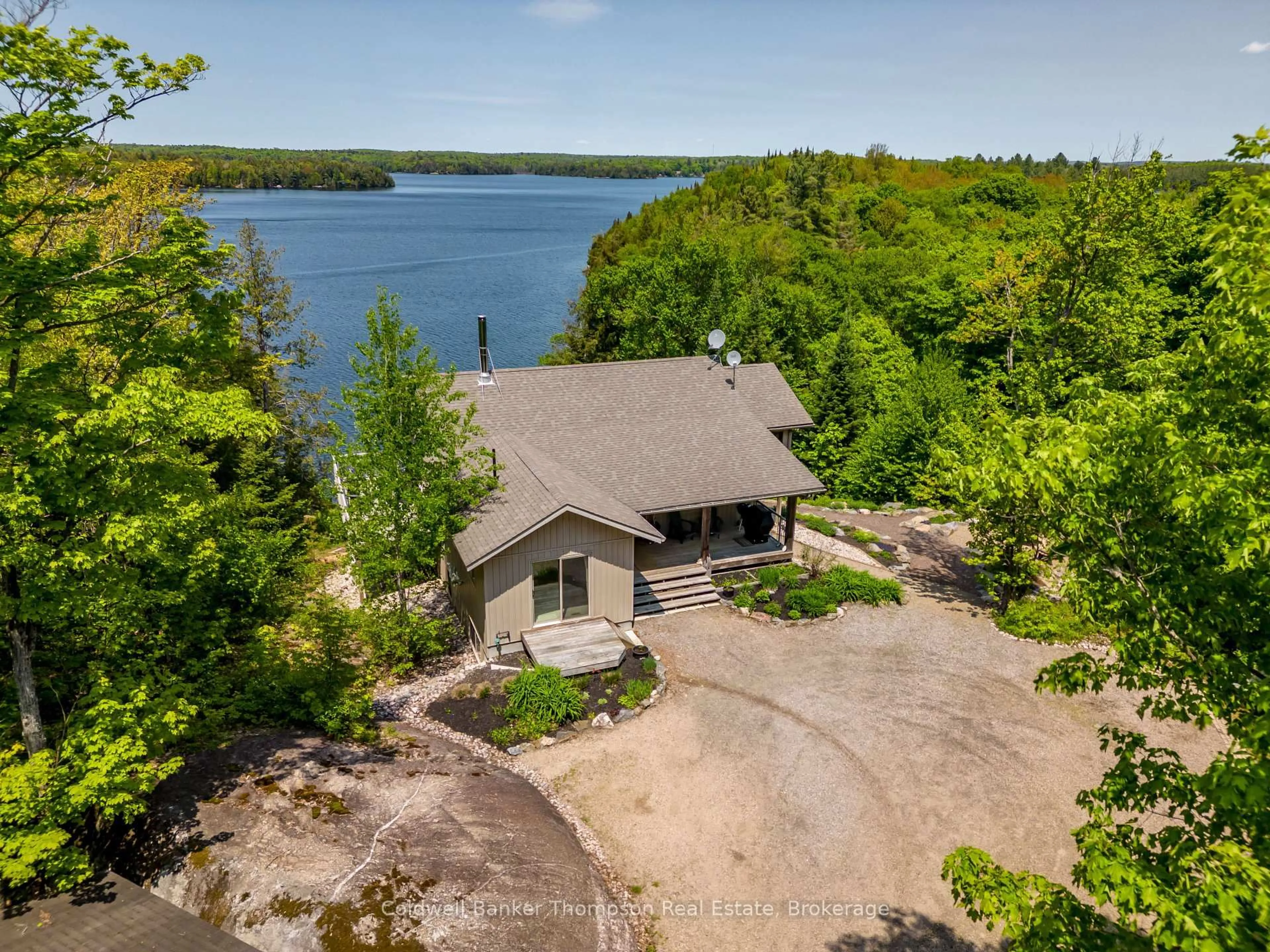 A pic from outside/outdoor area/front of a property/back of a property/a pic from drone, water/lake/river/ocean view for 1761 South Horn Lake Rd, Magnetawan Ontario P0A 1C0