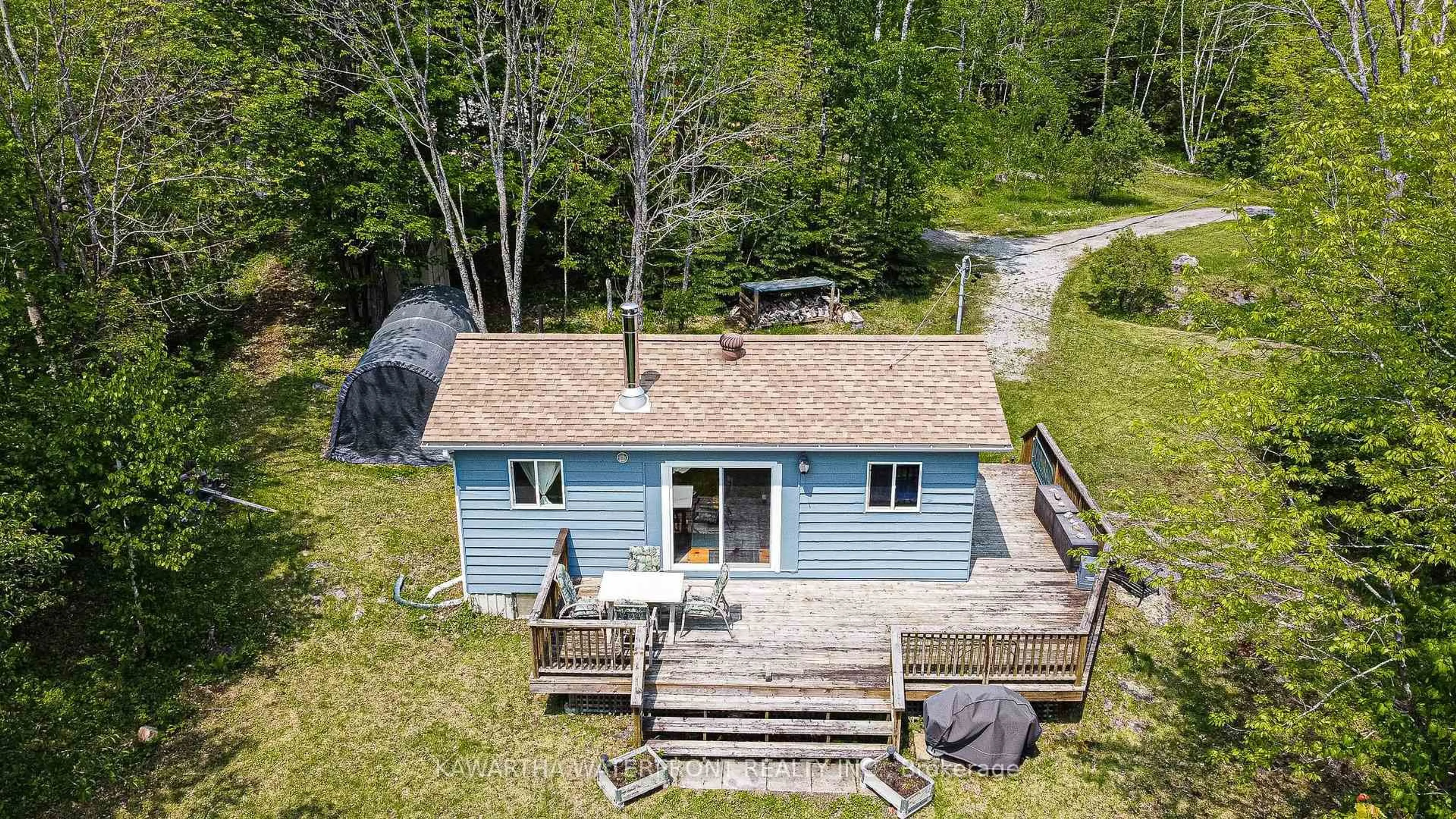 A pic from outside/outdoor area/front of a property/back of a property/a pic from drone, water/lake/river/ocean view for 1120 English Circ, Highlands East Ontario K0M 1R0