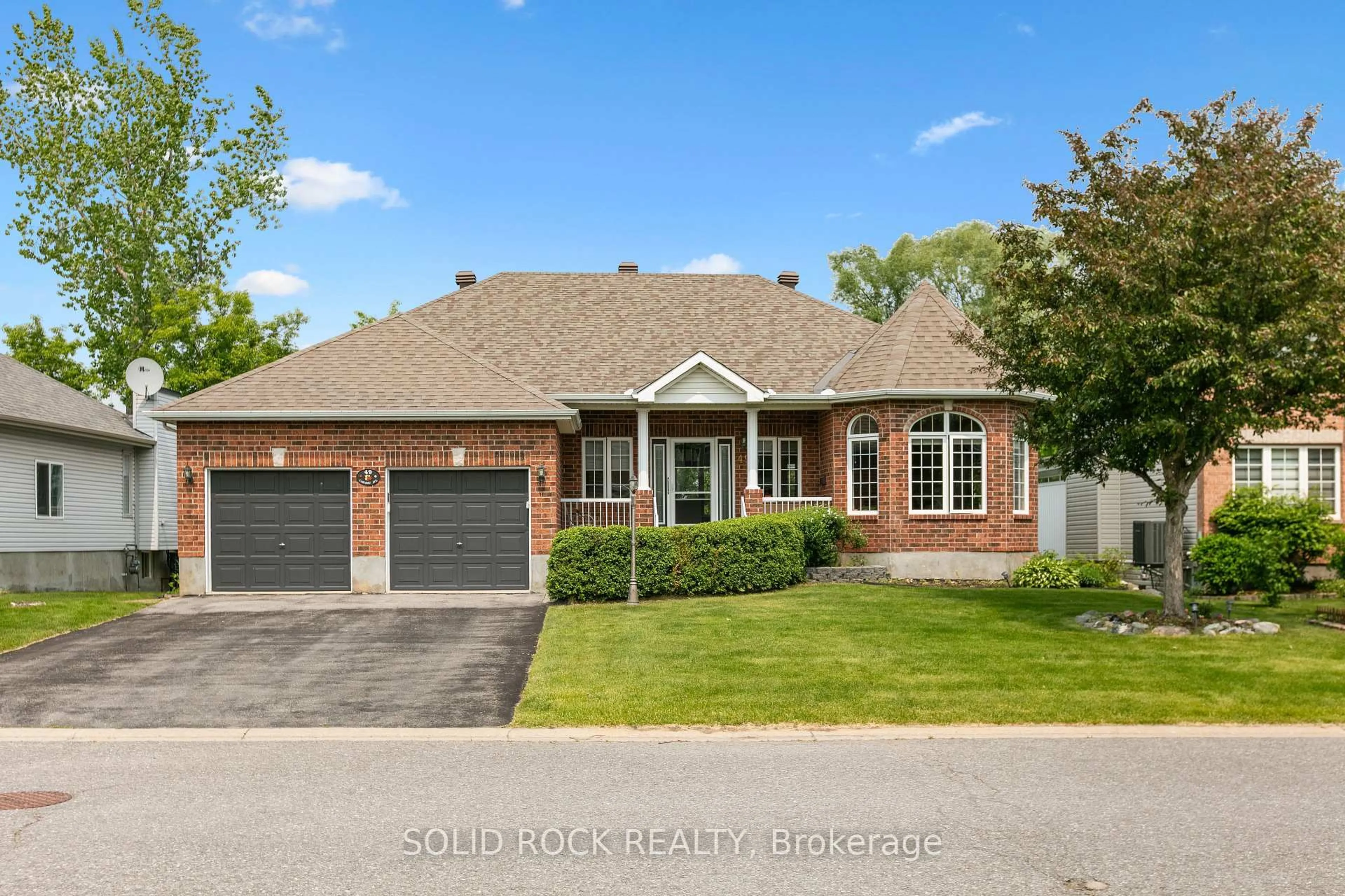 Home with brick exterior material, street for 49 Caribou Ave, Stittsville Ontario K2S 1X3