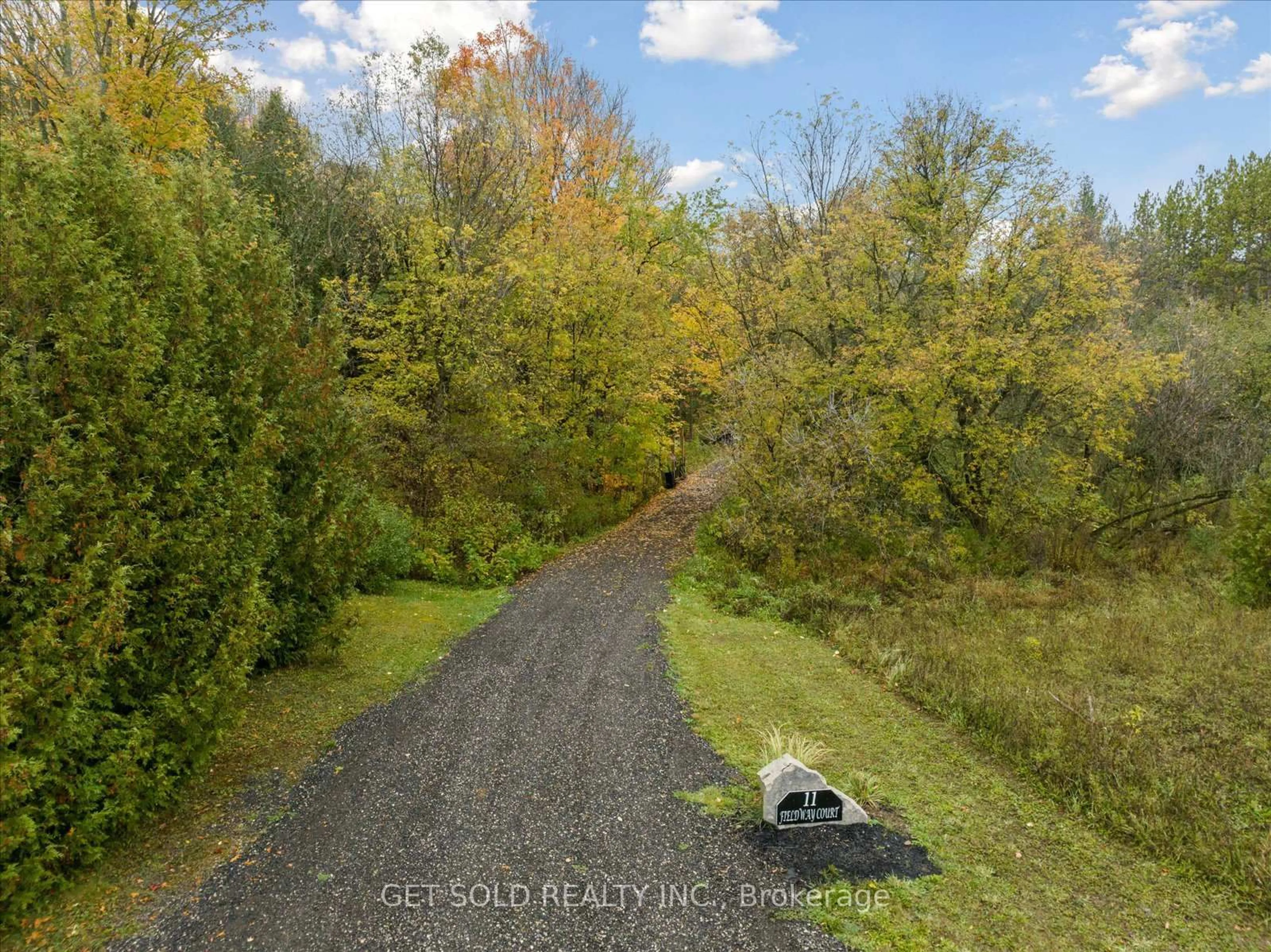 A pic from outside/outdoor area/front of a property/back of a property/a pic from drone, forest/trees view for 11 Fieldway Crt, Melancthon Ontario L0N 1J0