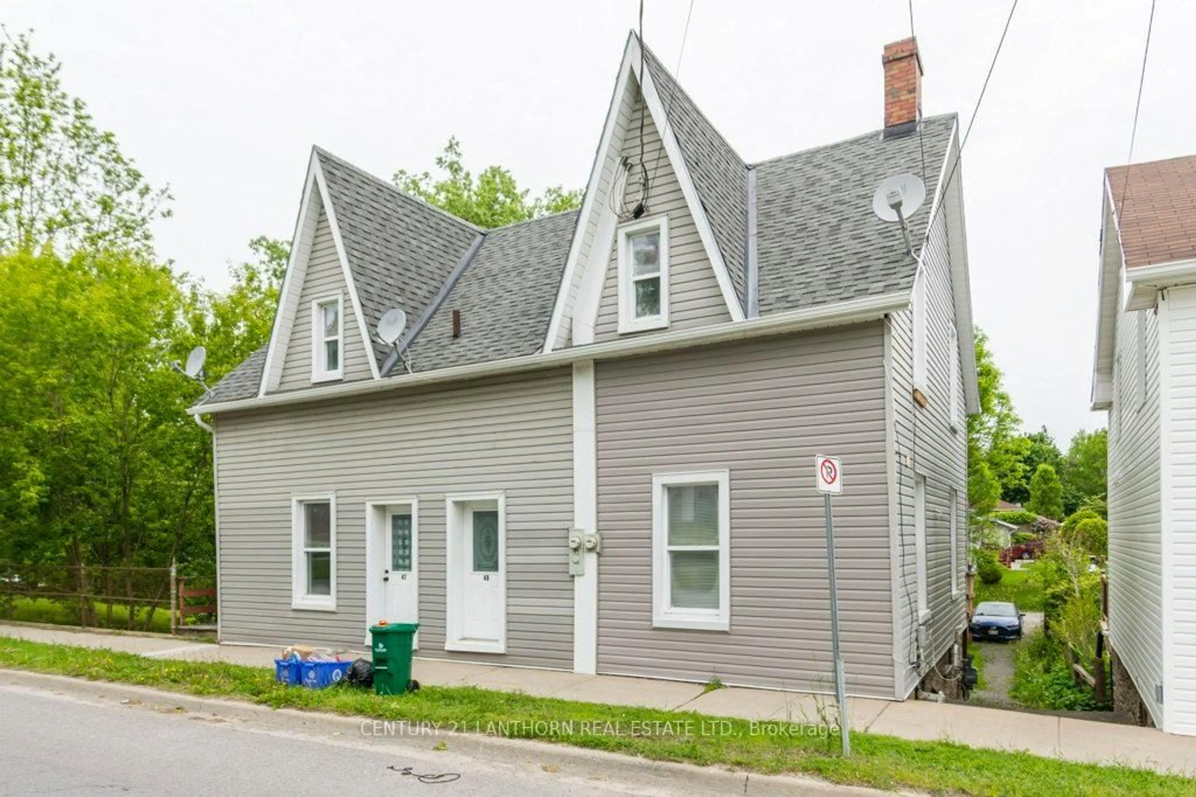 Home with vinyl exterior material, street for 47-49 Union St, Prince Edward County Ontario K0K 2T0