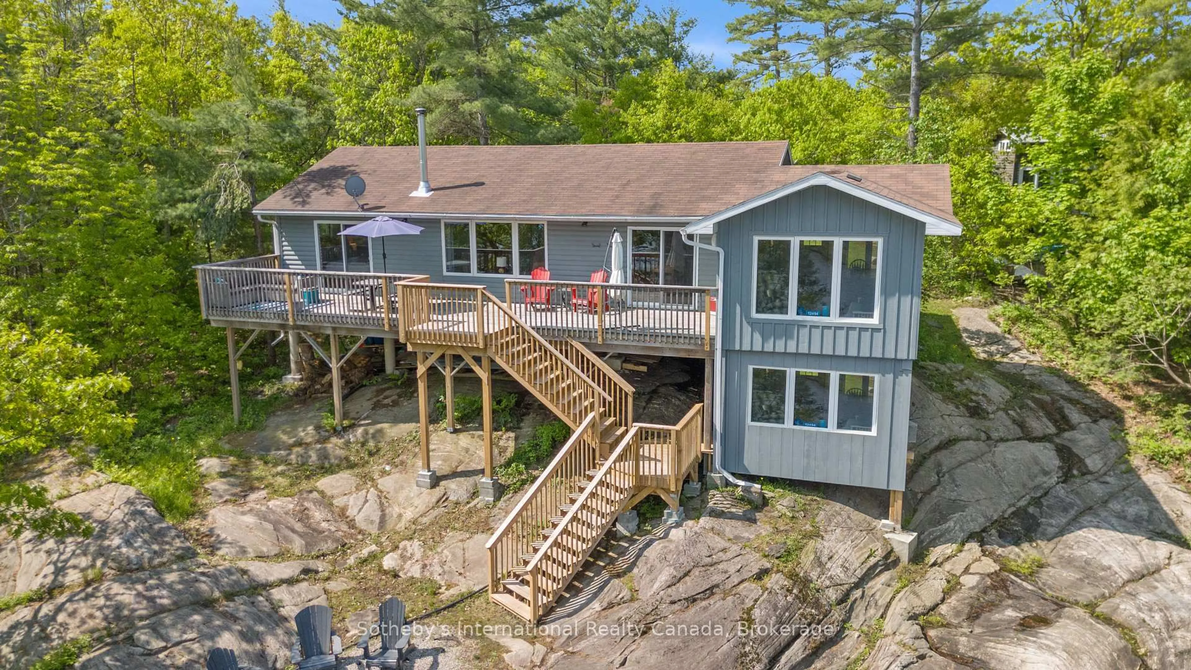 A pic from outside/outdoor area/front of a property/back of a property/a pic from drone, water/lake/river/ocean view for 12494 Georgian Bay Shore, Georgian Bay Ontario P0E 1E0