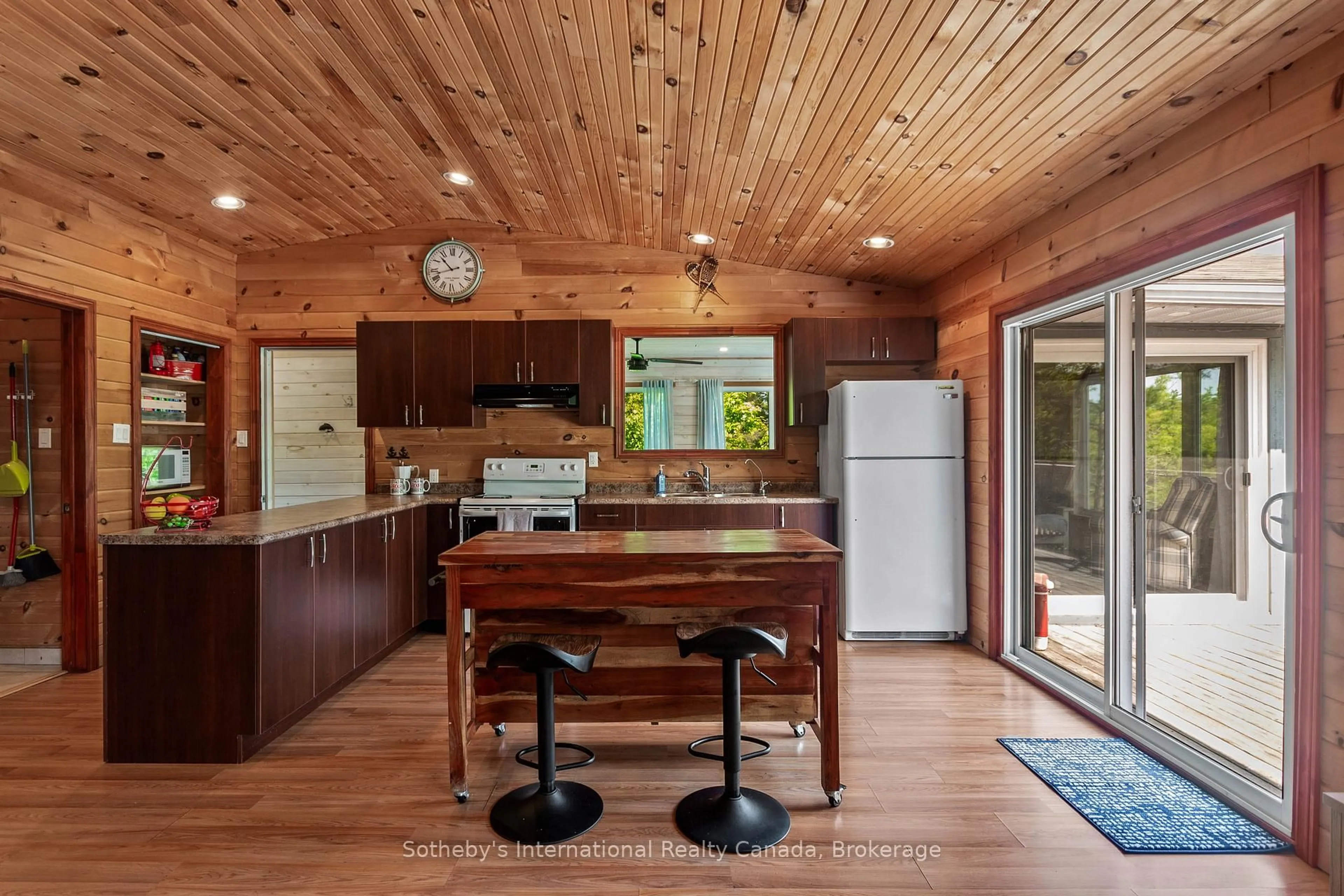 Open concept kitchen, wood/laminate floor for 12494 Georgian Bay Shore, Georgian Bay Ontario P0E 1E0