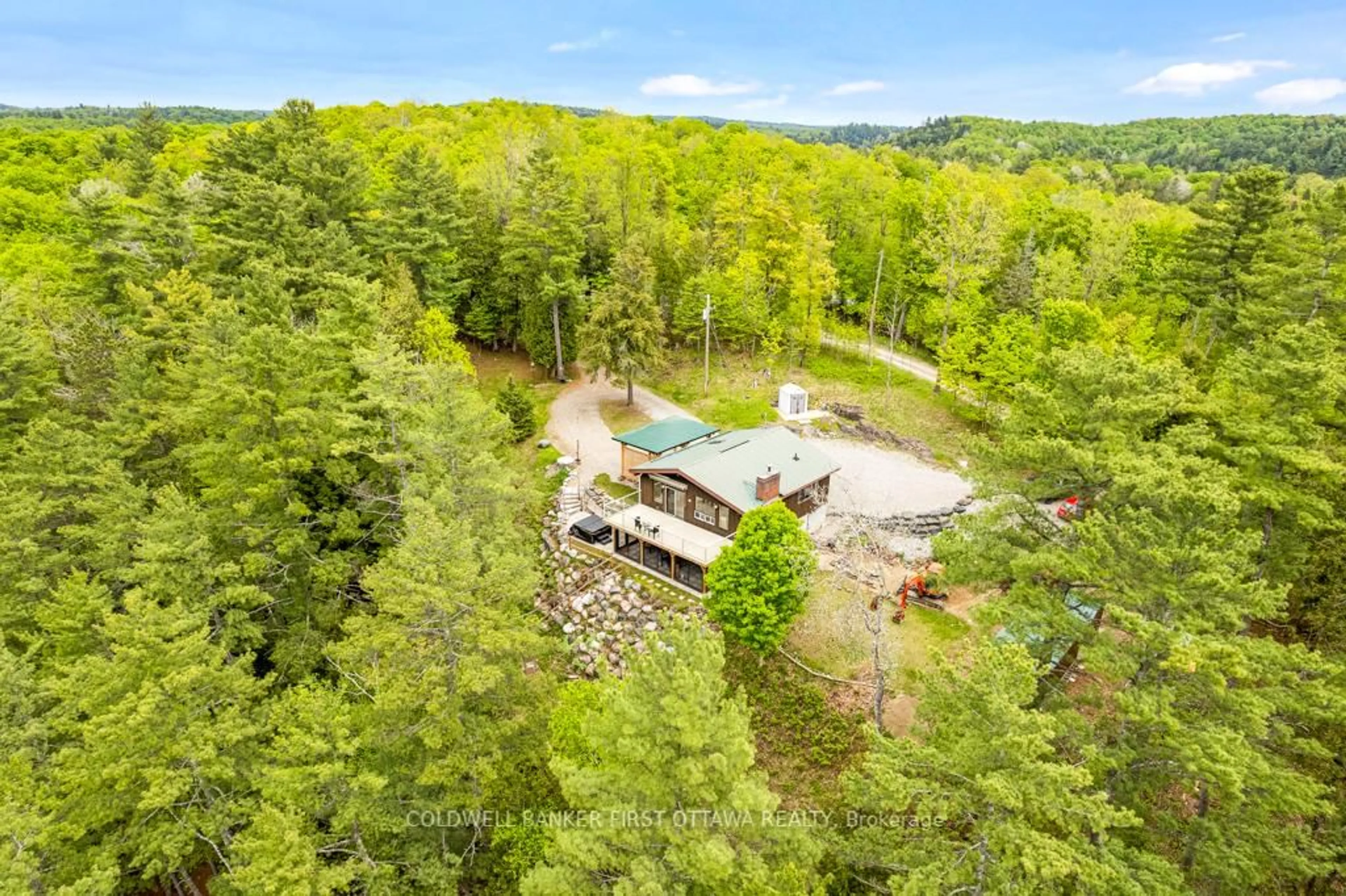 A pic from outside/outdoor area/front of a property/back of a property/a pic from drone, forest/trees view for 1036 Palmerston Cres, Snow Road Station Ontario K0H 2R0