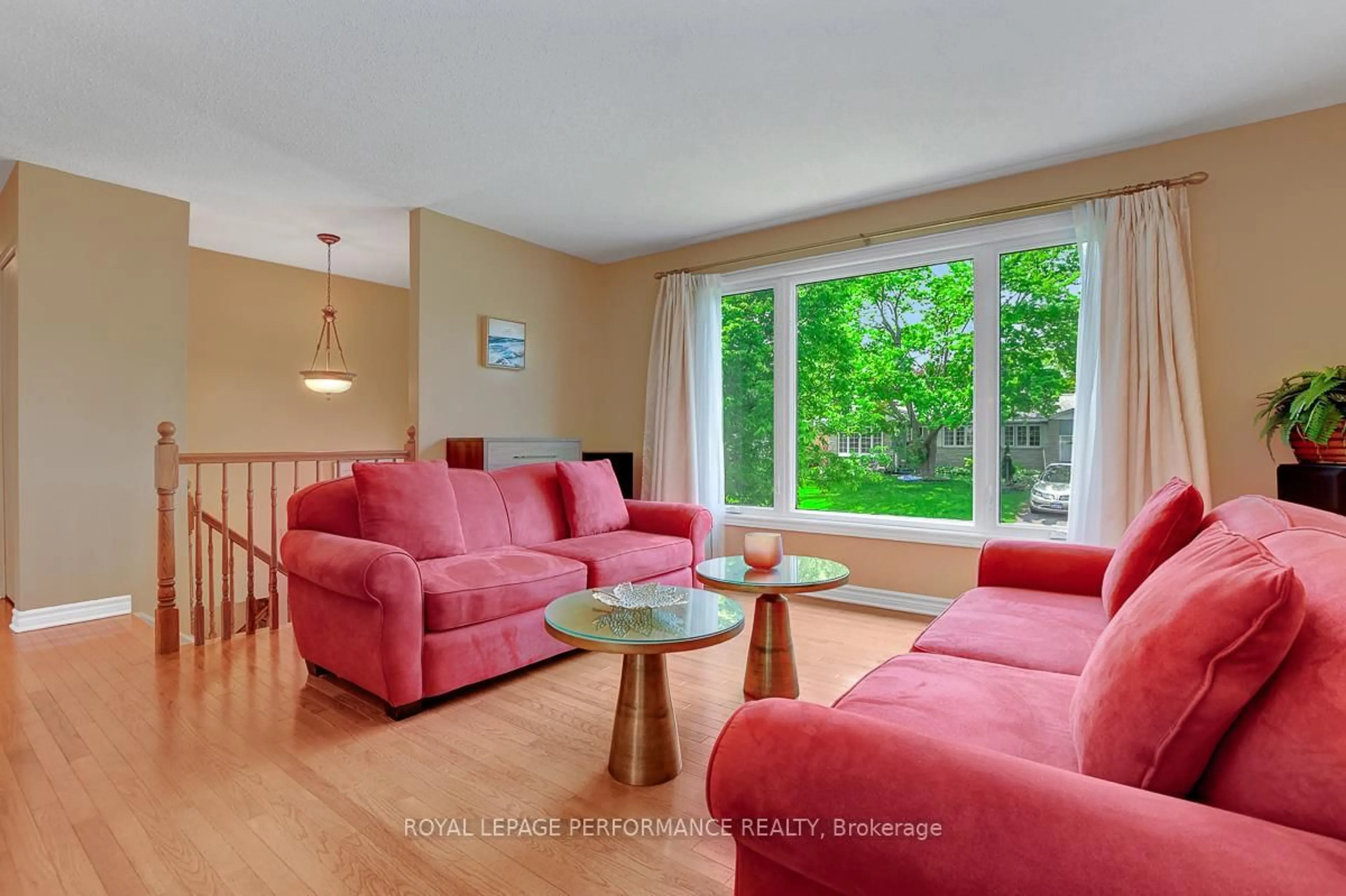 Living room with furniture, wood/laminate floor for 5 Veronica Pl, Ottawa Ontario K2H 8M3