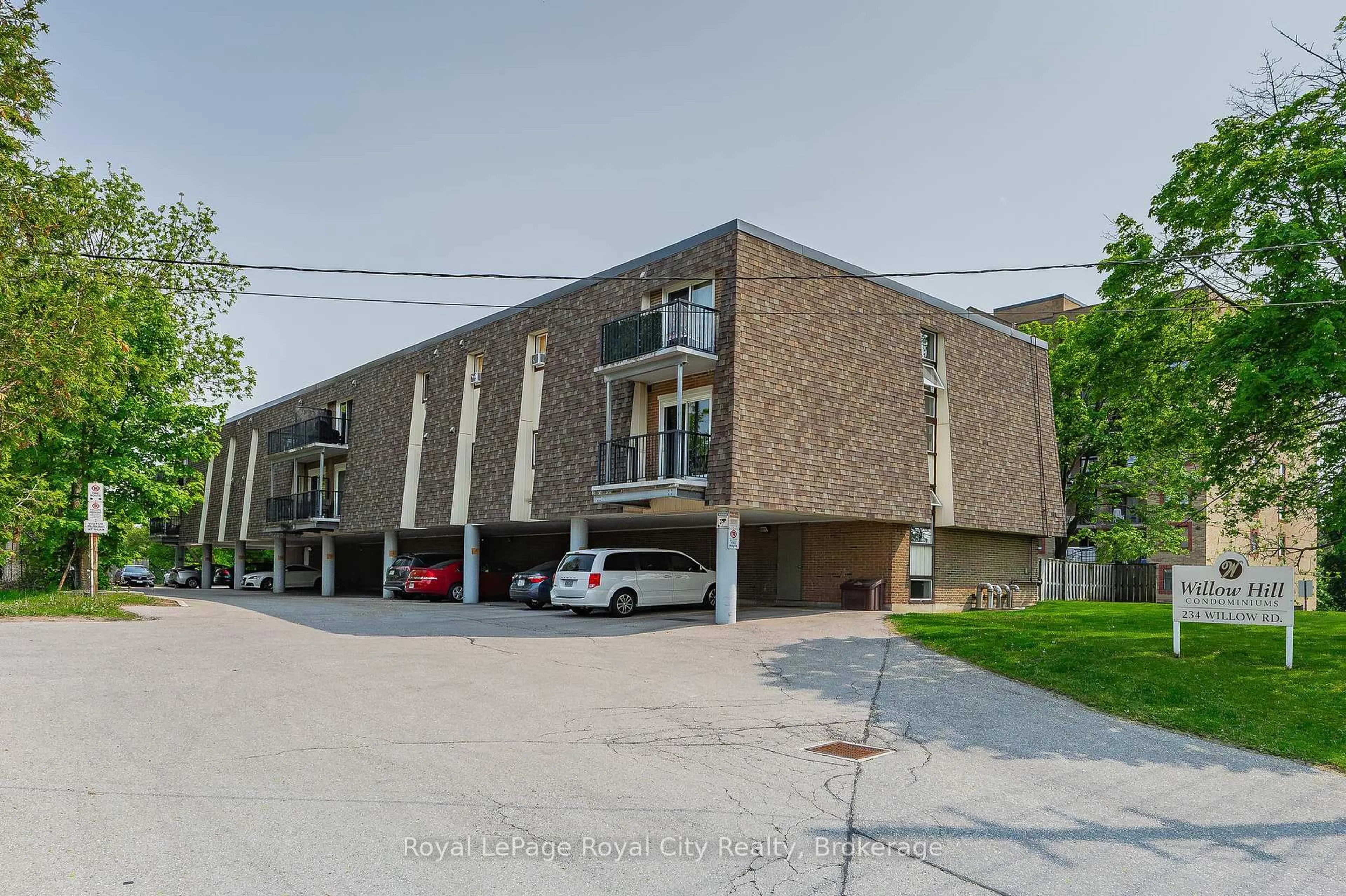 A pic from outside/outdoor area/front of a property/back of a property/a pic from drone, street for 234 Willow Rd #104, Guelph Ontario N1H 7C6