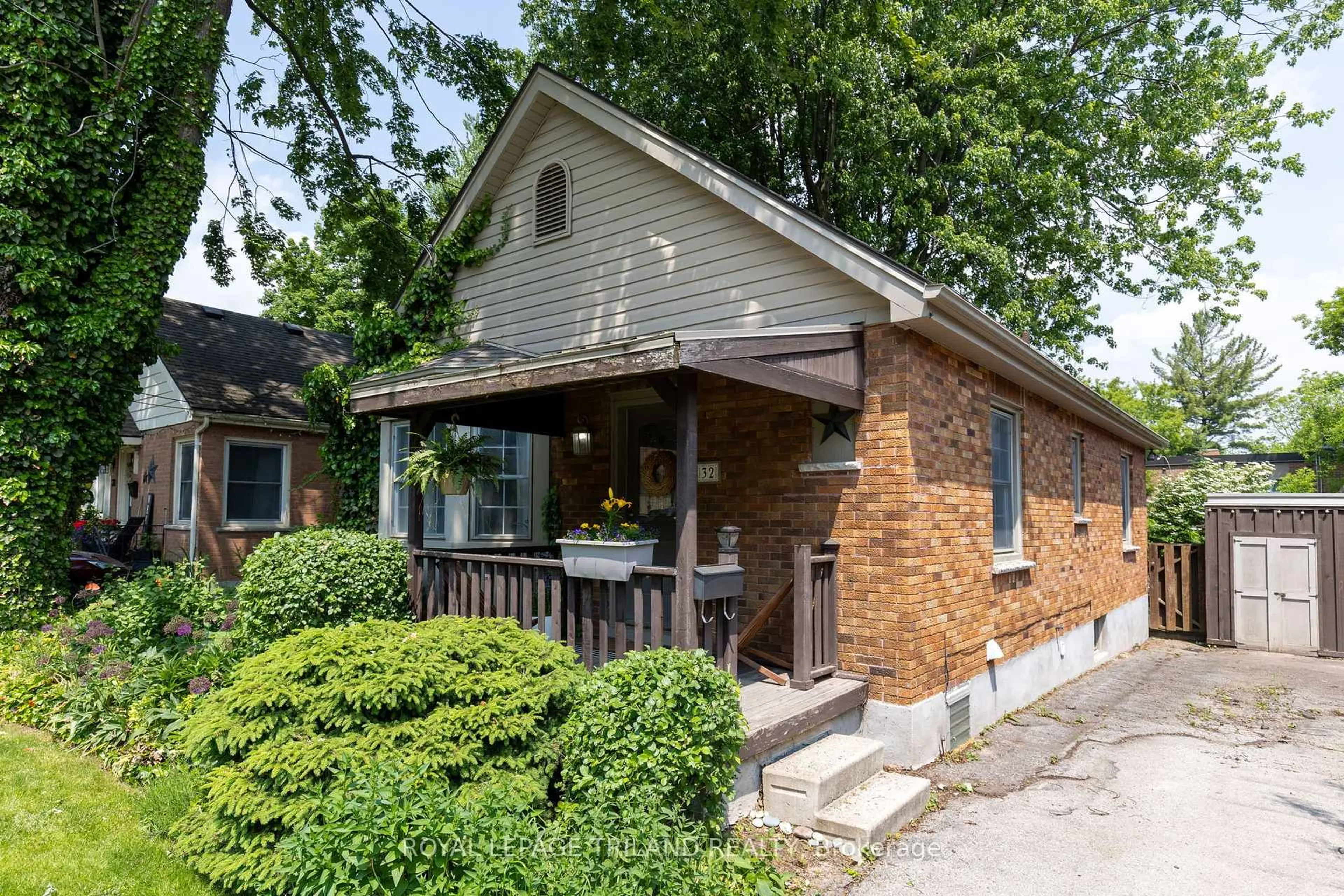 Home with brick exterior material, street for 32 Briscoe St, London South Ontario N6C 1W9