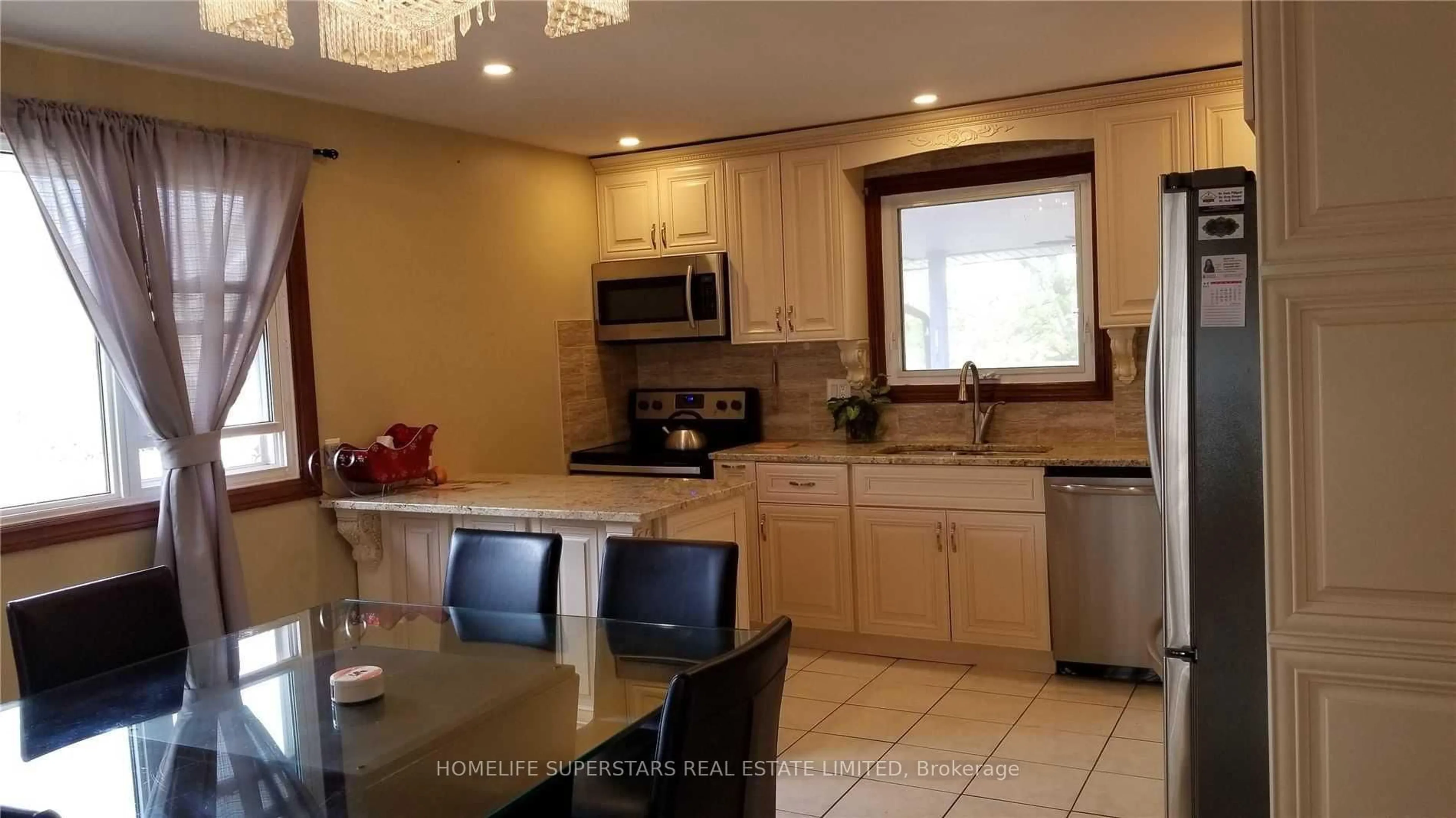 Open concept kitchen, ceramic/tile floor for 5532 Drummond Rd, Niagara Falls Ontario L2G 4L3