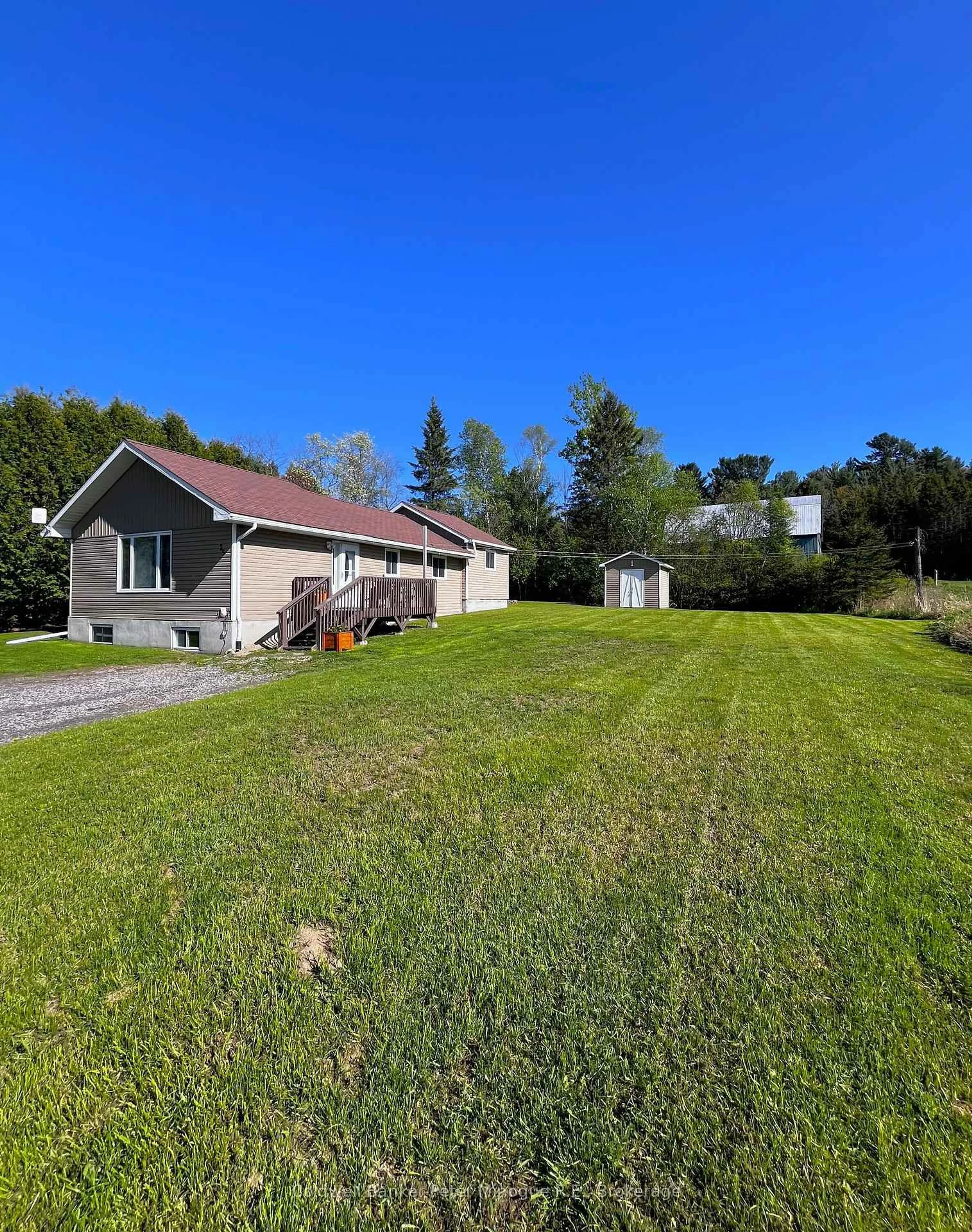 A pic from outside/outdoor area/front of a property/back of a property/a pic from drone, unknown for 25 Champagne Rd, East Ferris Ontario P0H 1K0