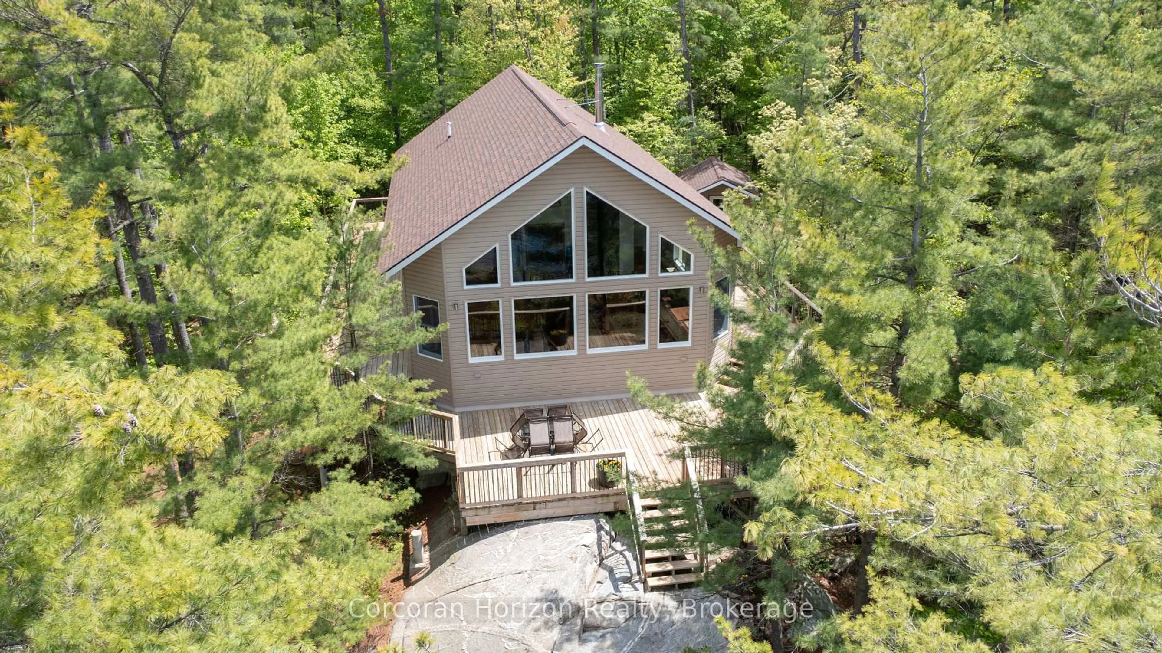 A pic from outside/outdoor area/front of a property/back of a property/a pic from drone, unknown for PT ISLAND 45 IN SIX MILE LAKE, Georgian Bay Ontario L0K 1S0