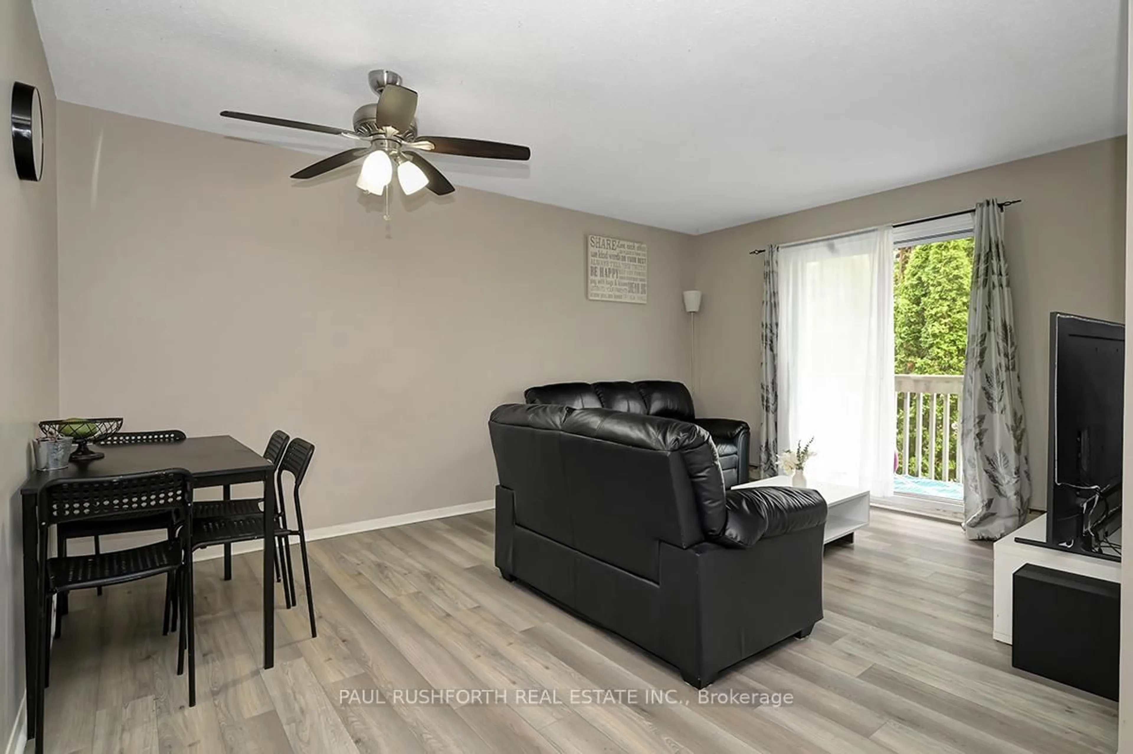 Living room with furniture, wood/laminate floor for 325 Centrum Blvd #314, Ottawa Ontario K1E 3W8