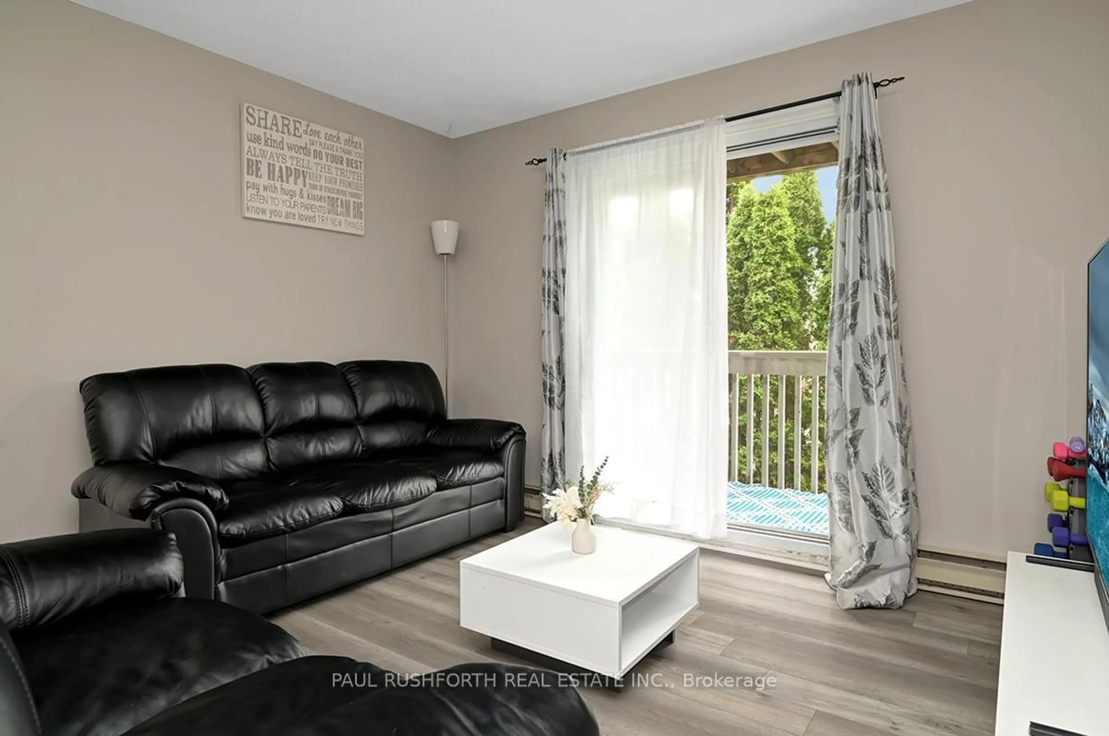 Living room with furniture, wood/laminate floor for 325 Centrum Blvd #314, Ottawa Ontario K1E 3W8