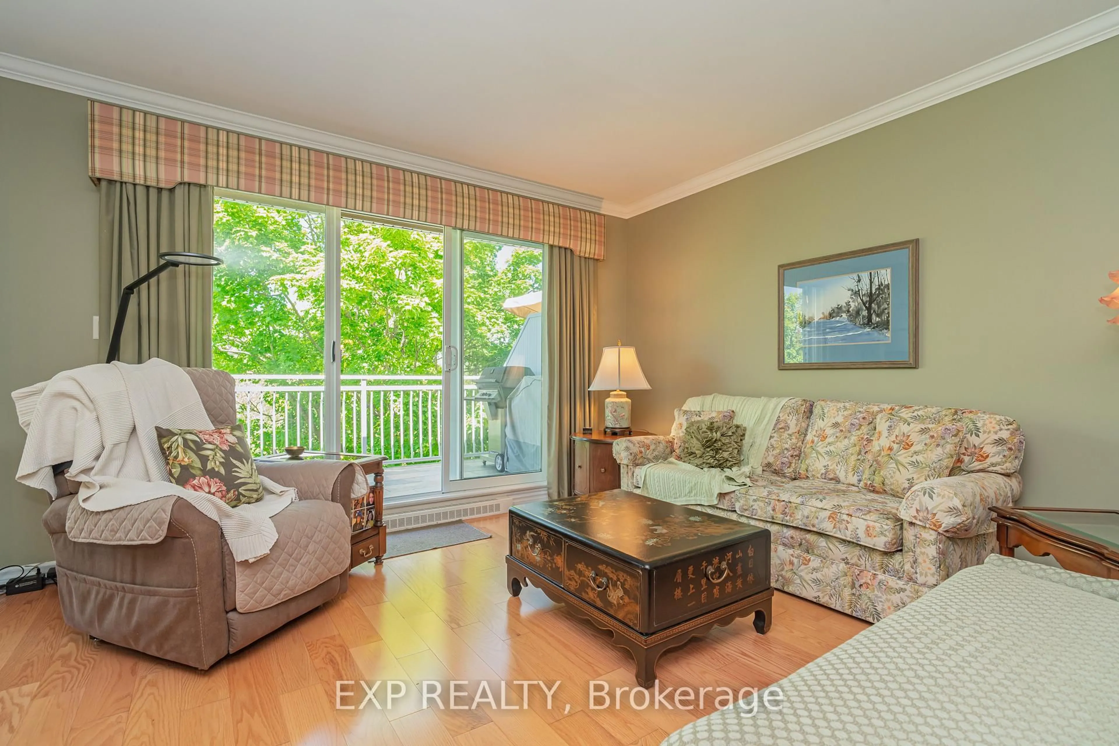 Living room with furniture, wood/laminate floor for 111 Robson Crt #2B, Ottawa Ontario K2K 2W1