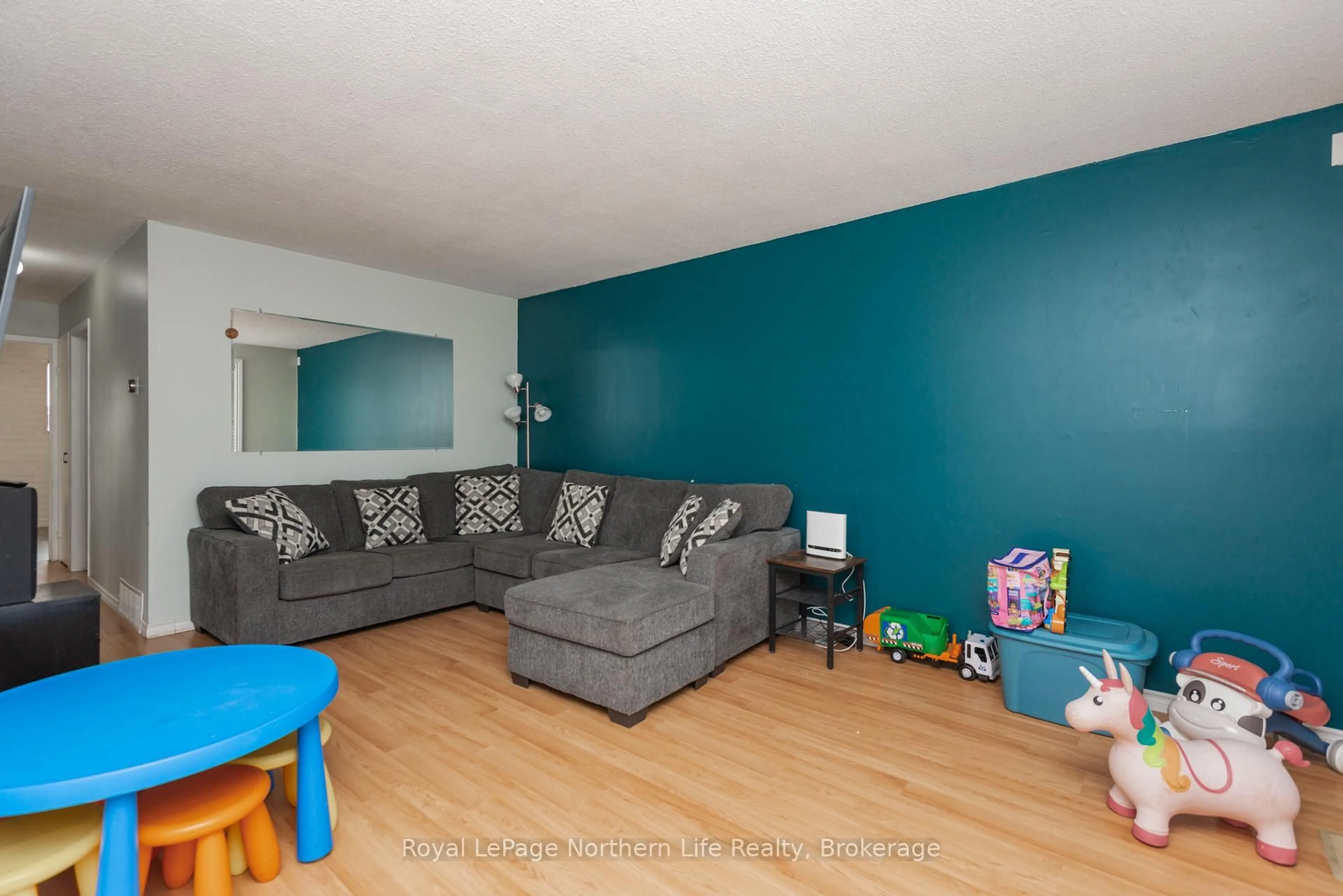 Living room with furniture, wood/laminate floor for 54 Van Horne Cres, North Bay Ontario P1A 1G3
