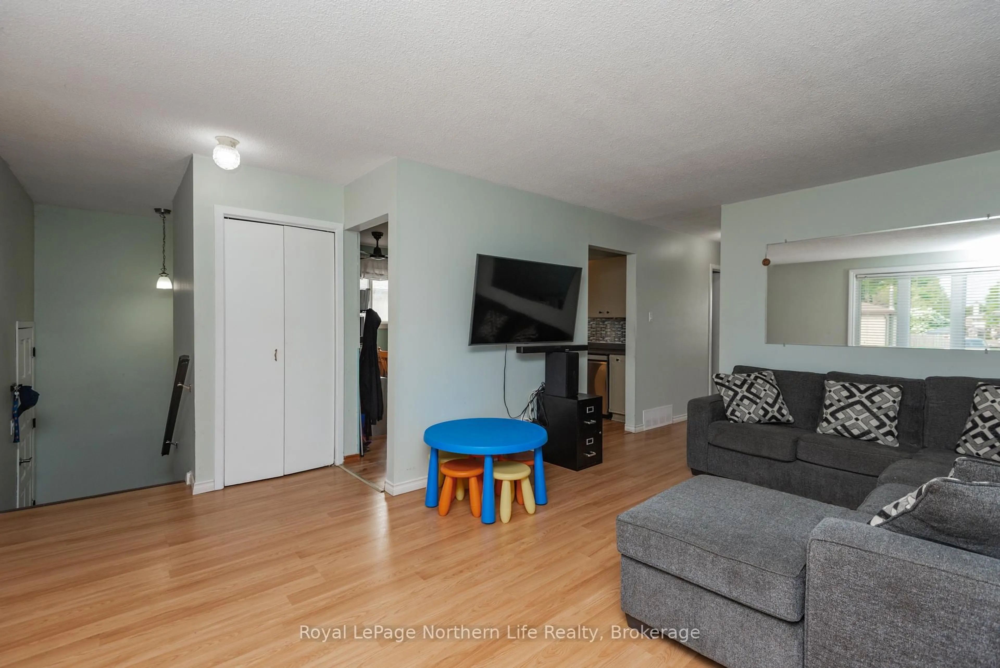 Living room with furniture, wood/laminate floor for 54 Van Horne Cres, North Bay Ontario P1A 1G3