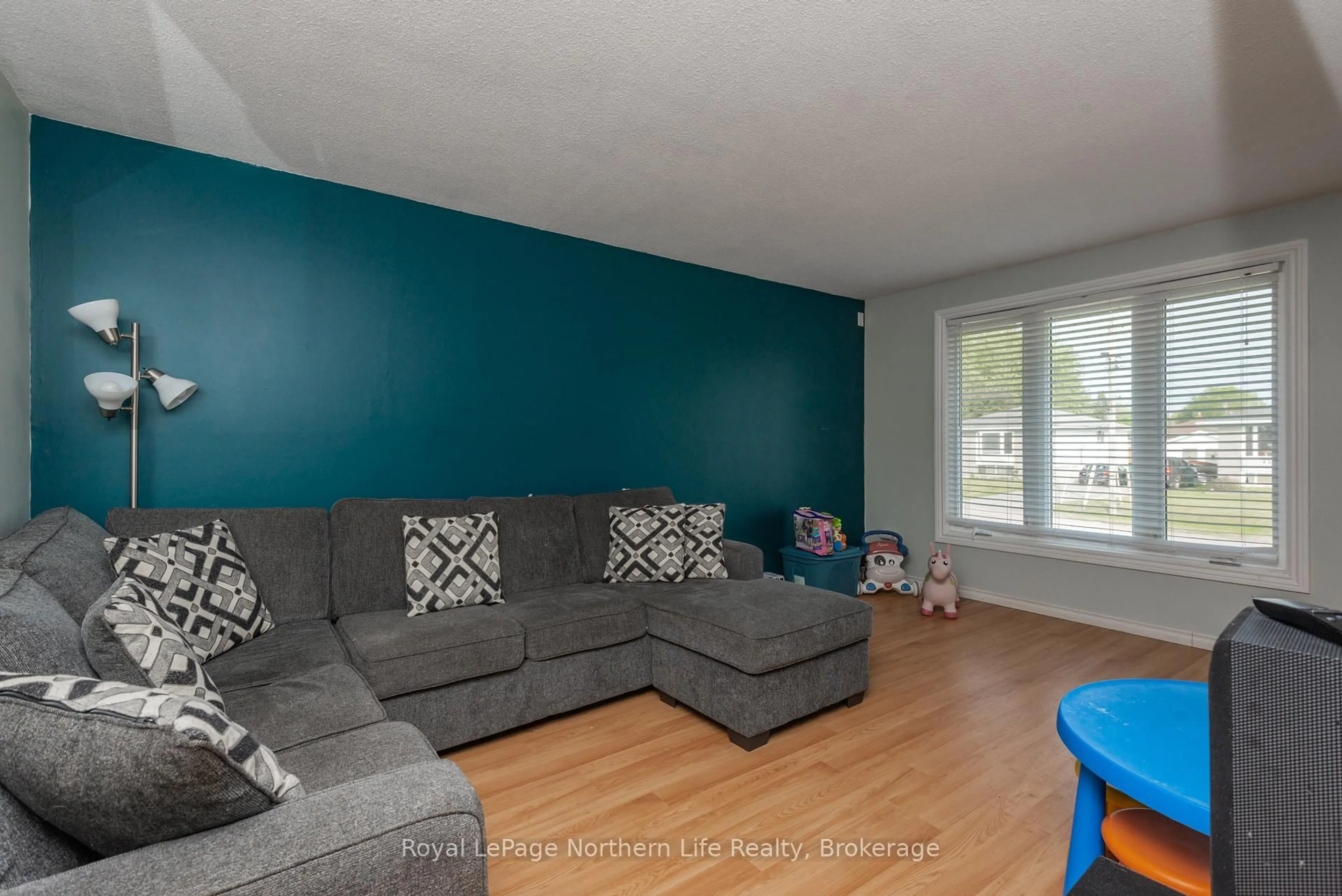 Living room with furniture, wood/laminate floor for 54 Van Horne Cres, North Bay Ontario P1A 1G3