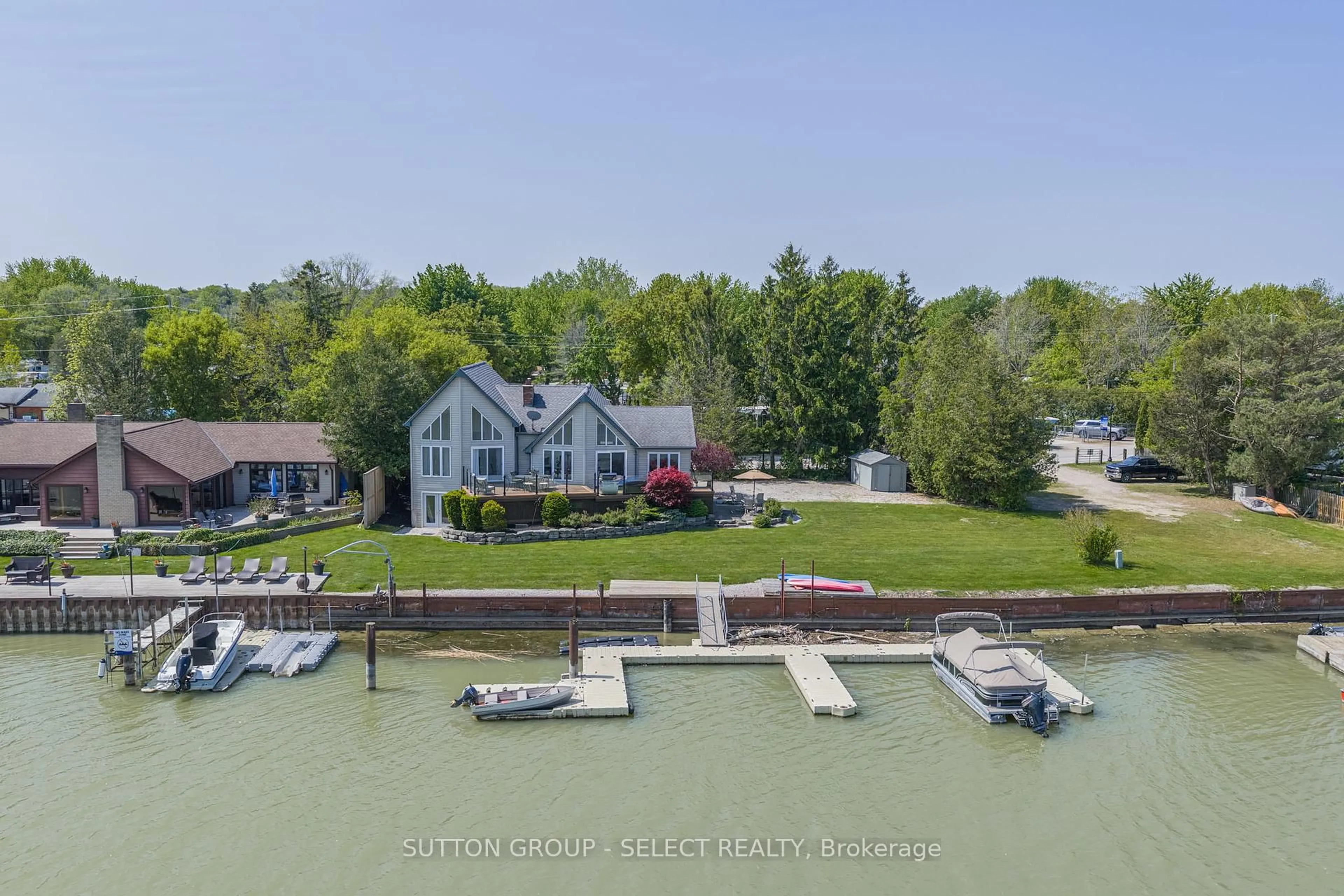 A pic from outside/outdoor area/front of a property/back of a property/a pic from drone, water/lake/river/ocean view for 7474 Riverside Dr, Lambton Shores Ontario N0M 2L0