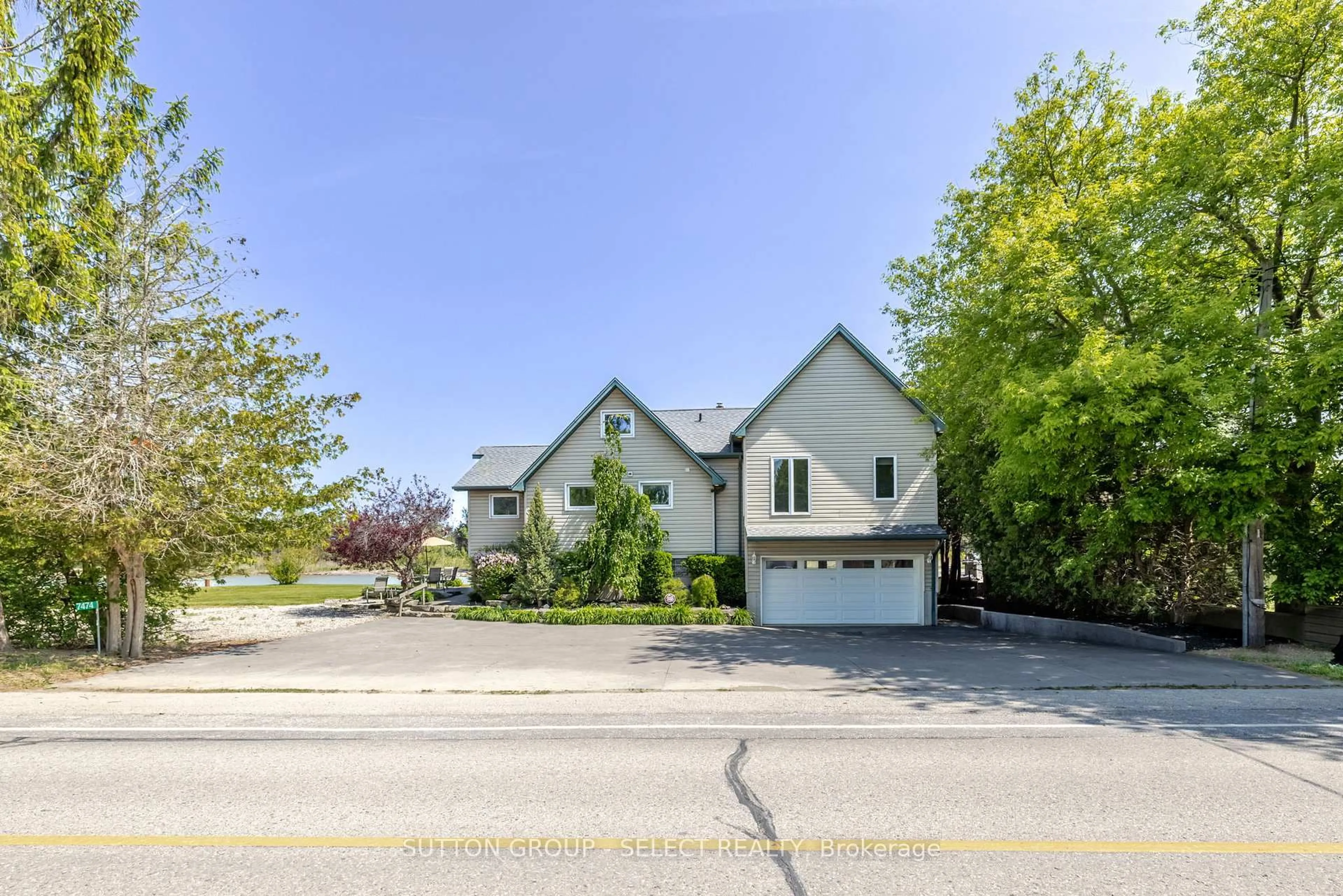 A pic from outside/outdoor area/front of a property/back of a property/a pic from drone, street for 7474 Riverside Dr, Lambton Shores Ontario N0M 2L0