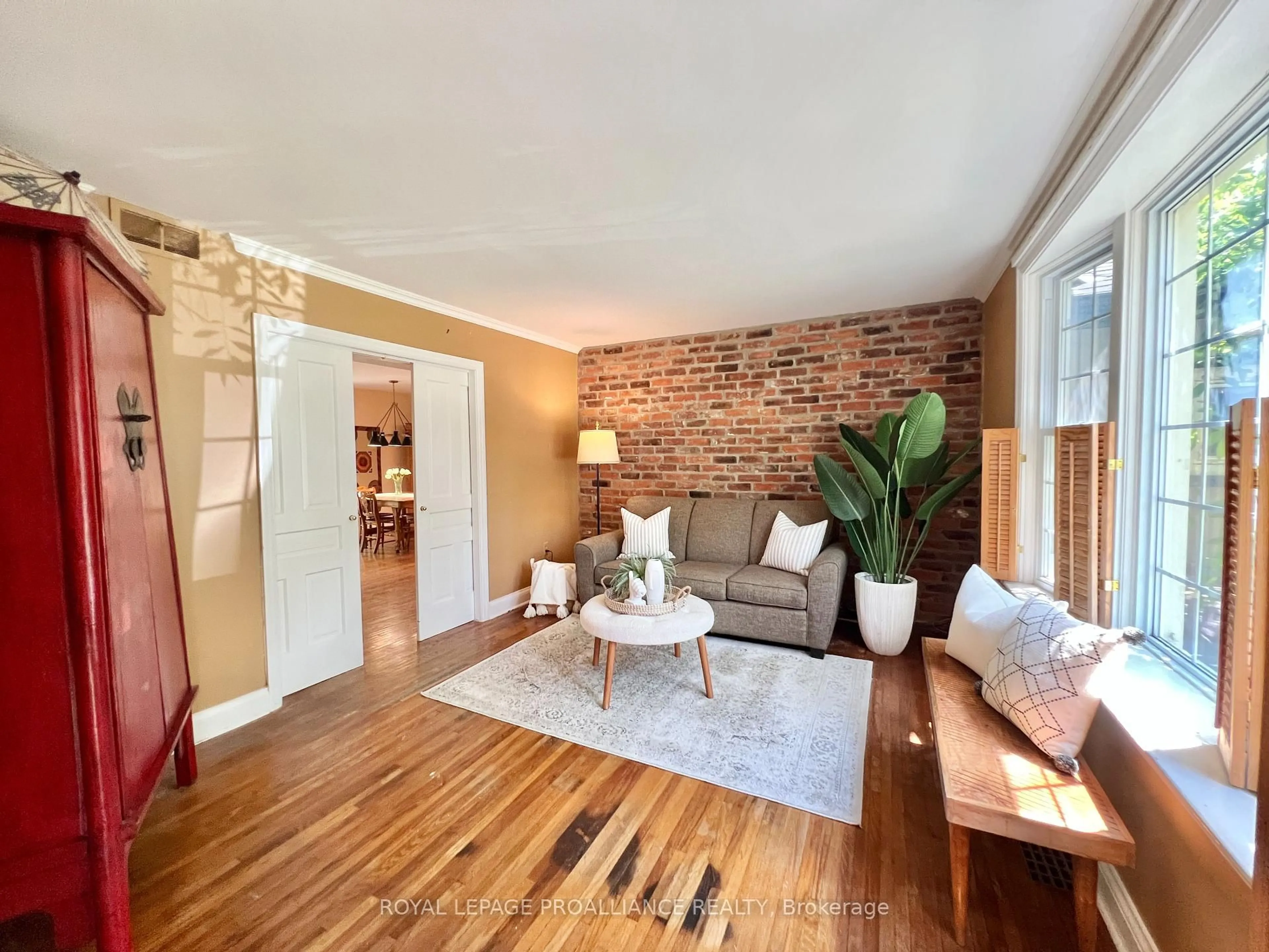 Living room with furniture, wood/laminate floor for 243 George St, Belleville Ontario K8N 3H7