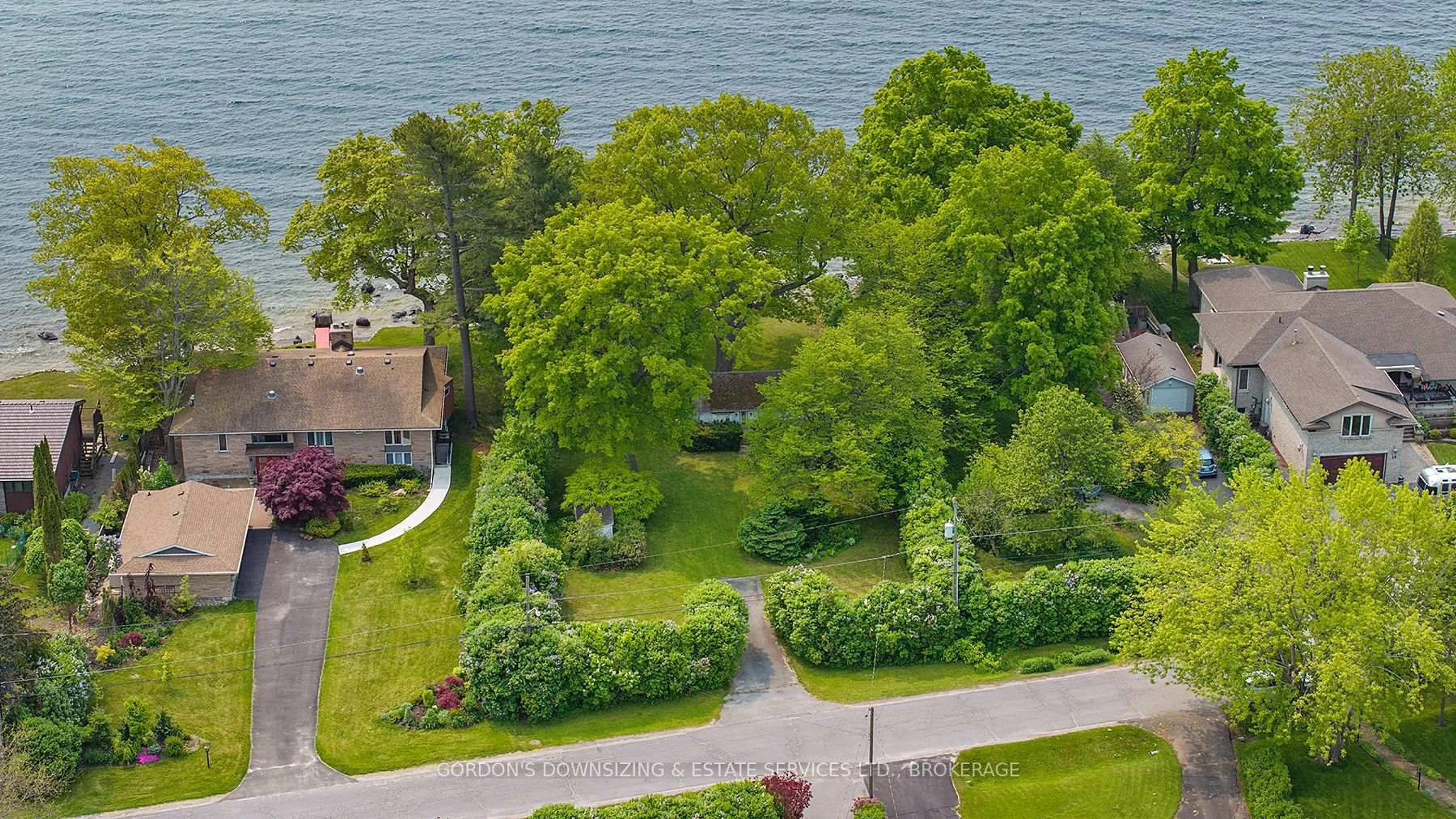 A pic from outside/outdoor area/front of a property/back of a property/a pic from drone, water/lake/river/ocean view for 10 Lakeshore Blvd, Kingston Ontario K7M 4J6