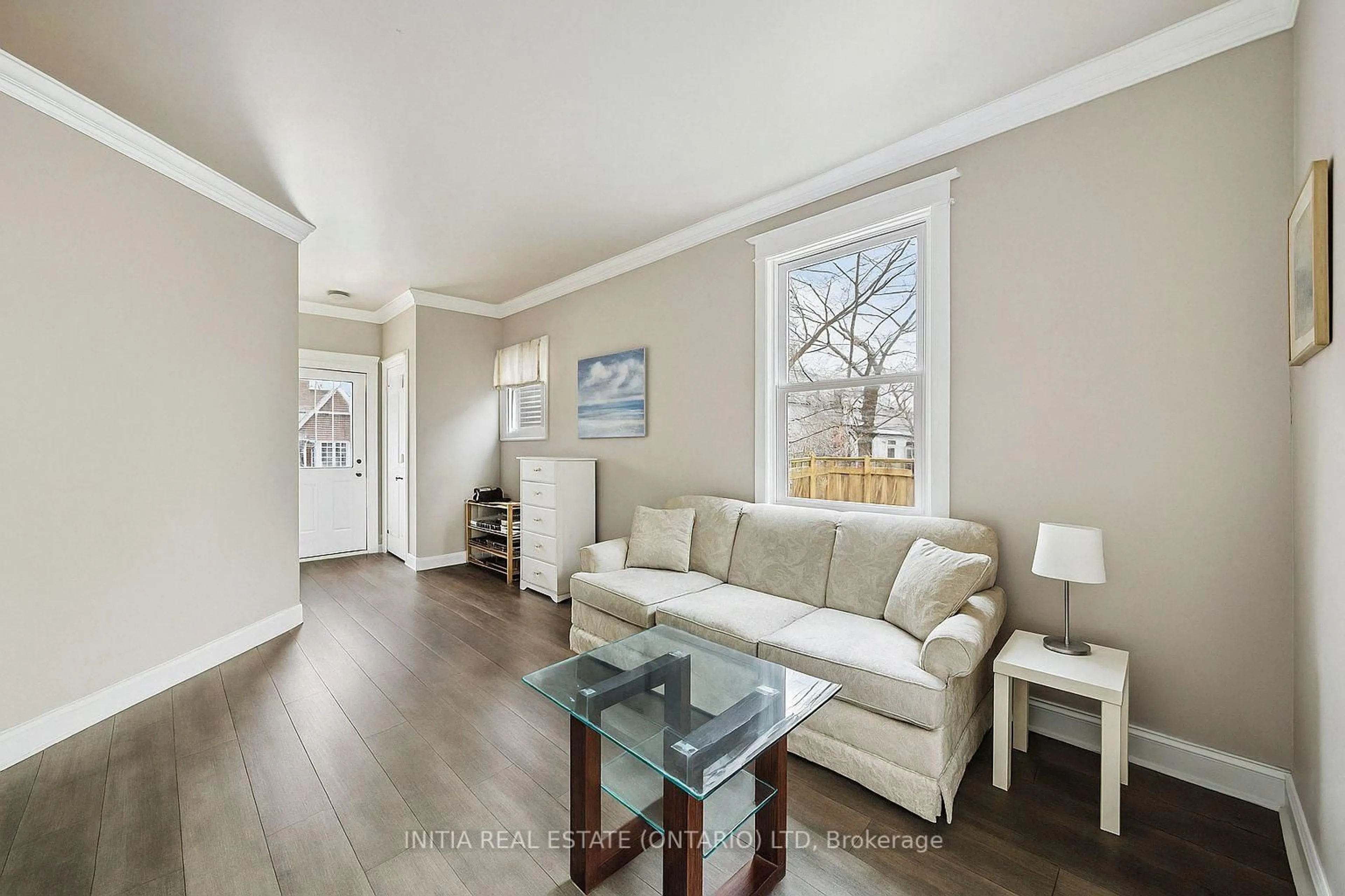 Living room with furniture, wood/laminate floor for 150 College Ave, Sarnia Ontario N7T 6B3