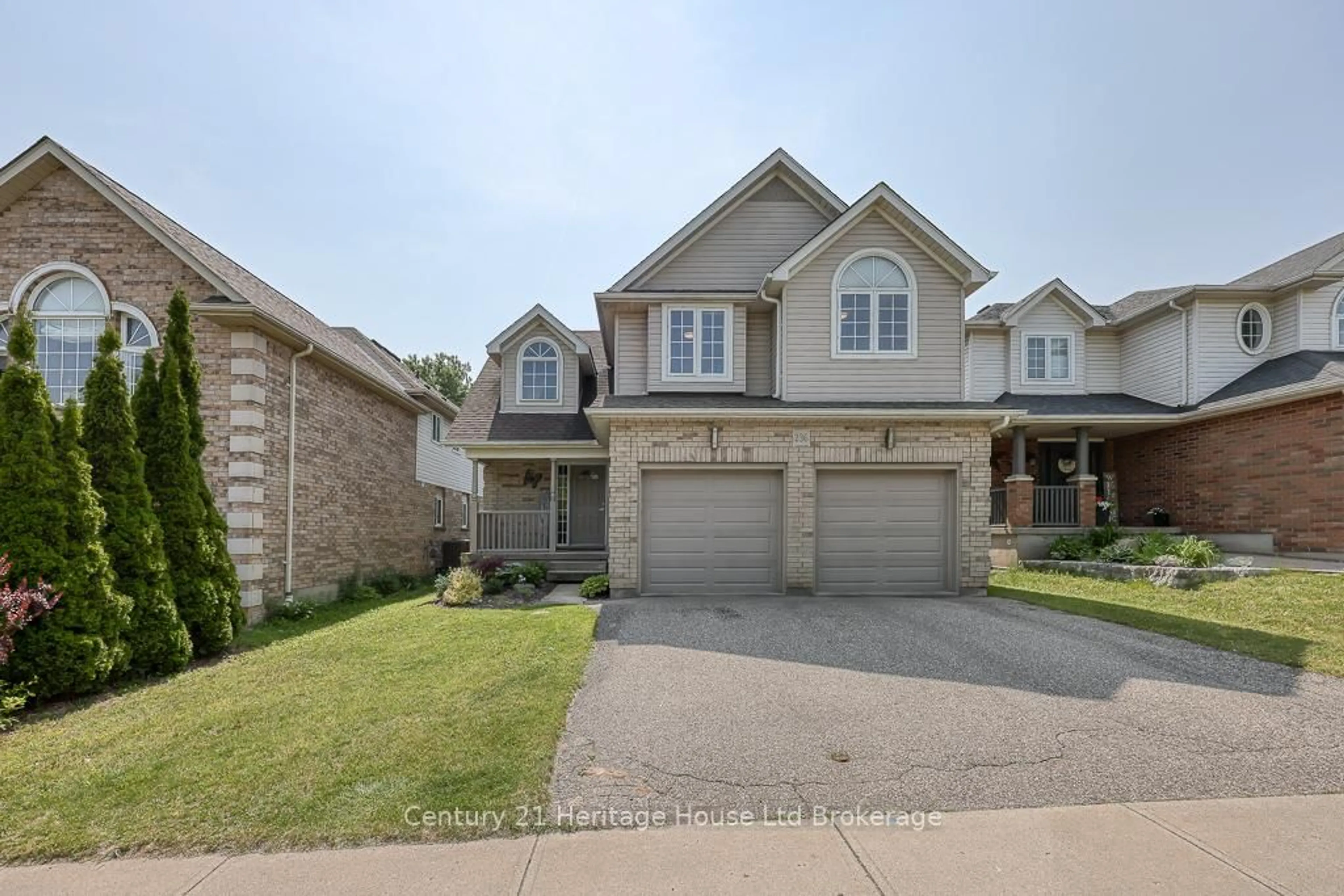 Home with brick exterior material, street for 236 Doon South Dr, Kitchener Ontario N2P 2L8