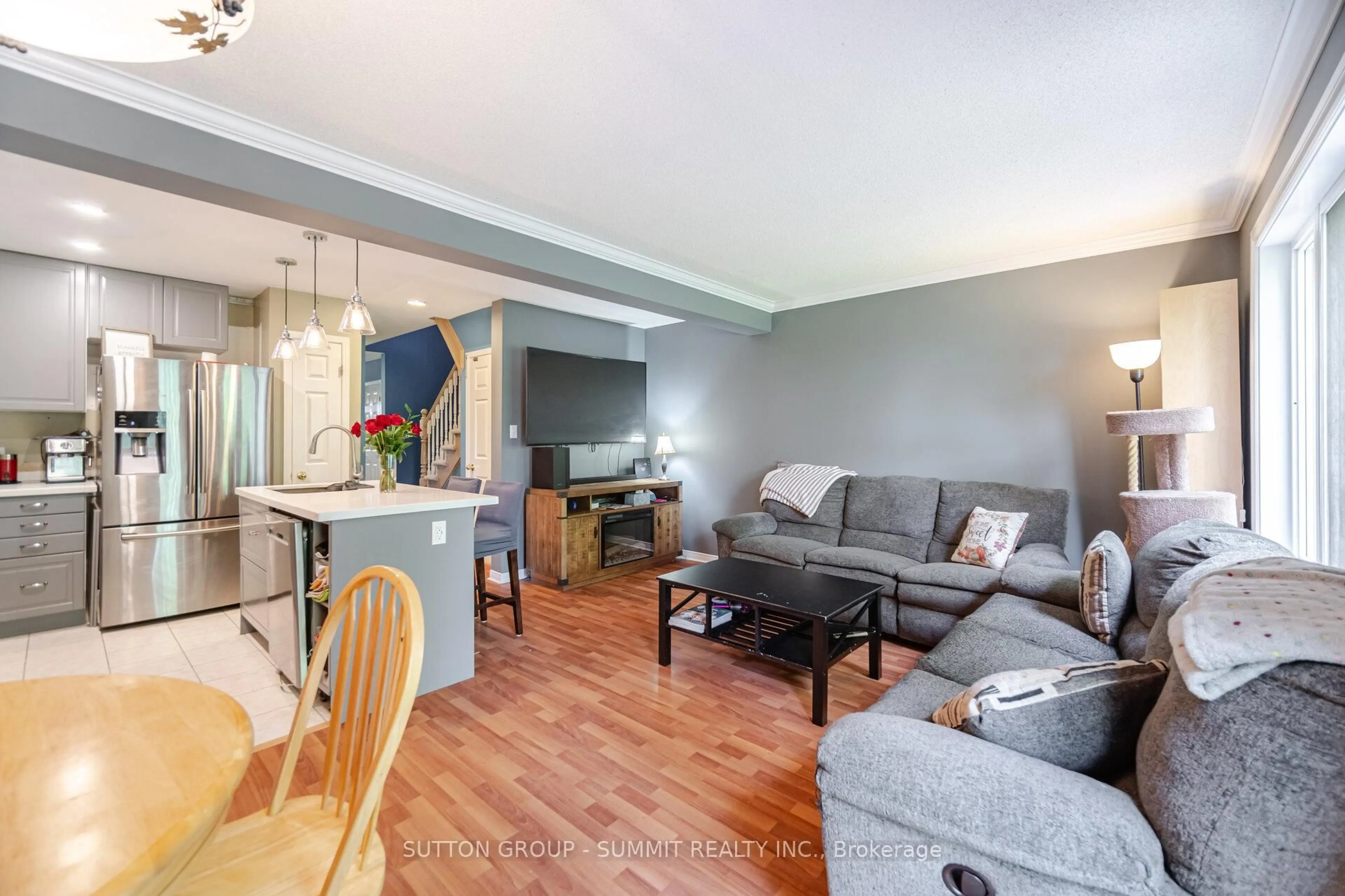 Living room with furniture, wood/laminate floor for 1809 Upper Wentworth St #32, Hamilton Ontario L9B 2R9