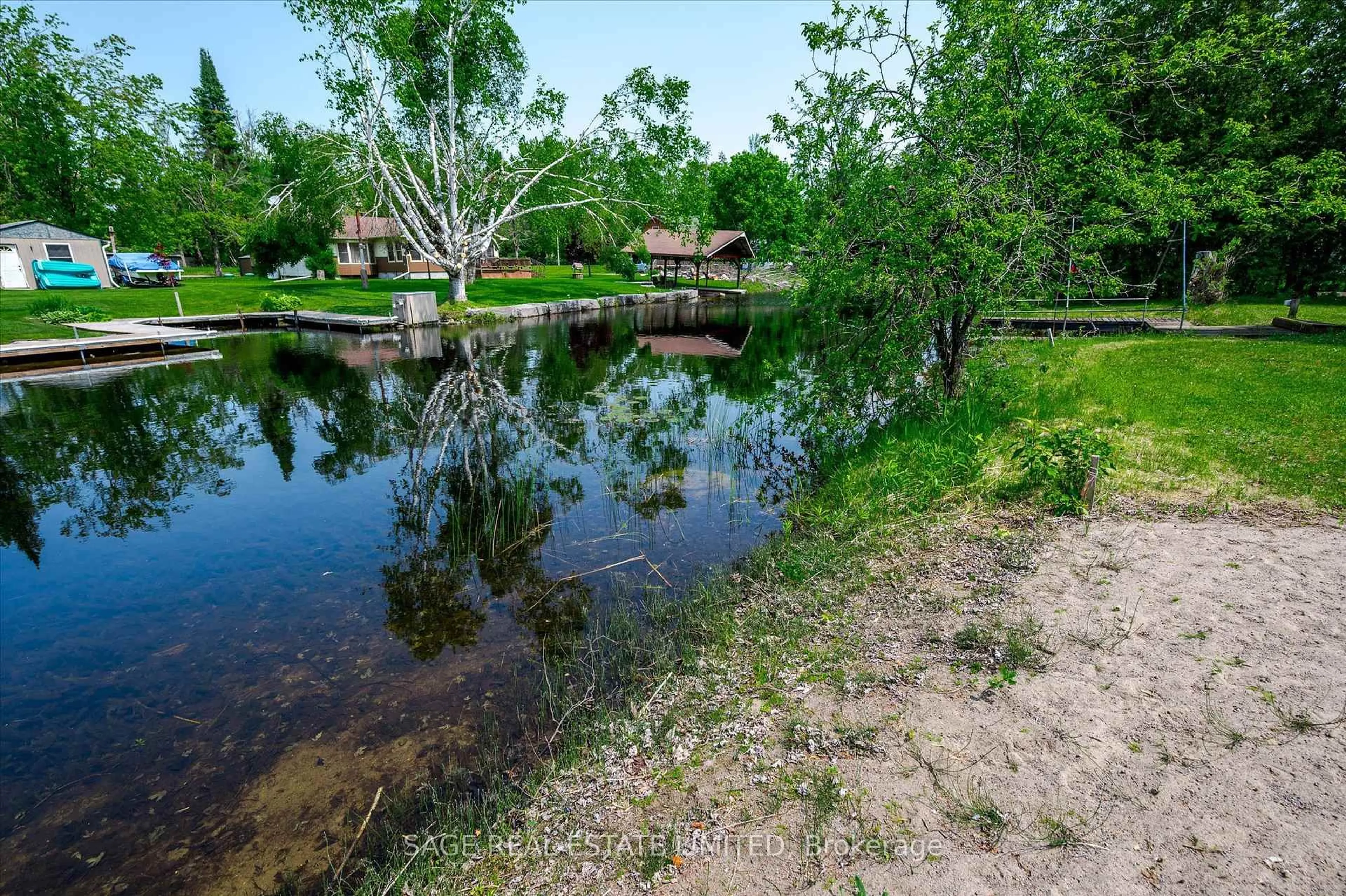 A pic from outside/outdoor area/front of a property/back of a property/a pic from drone, water/lake/river/ocean view for 33 Fire Route 104, Trent Lakes Ontario K0M 1A0