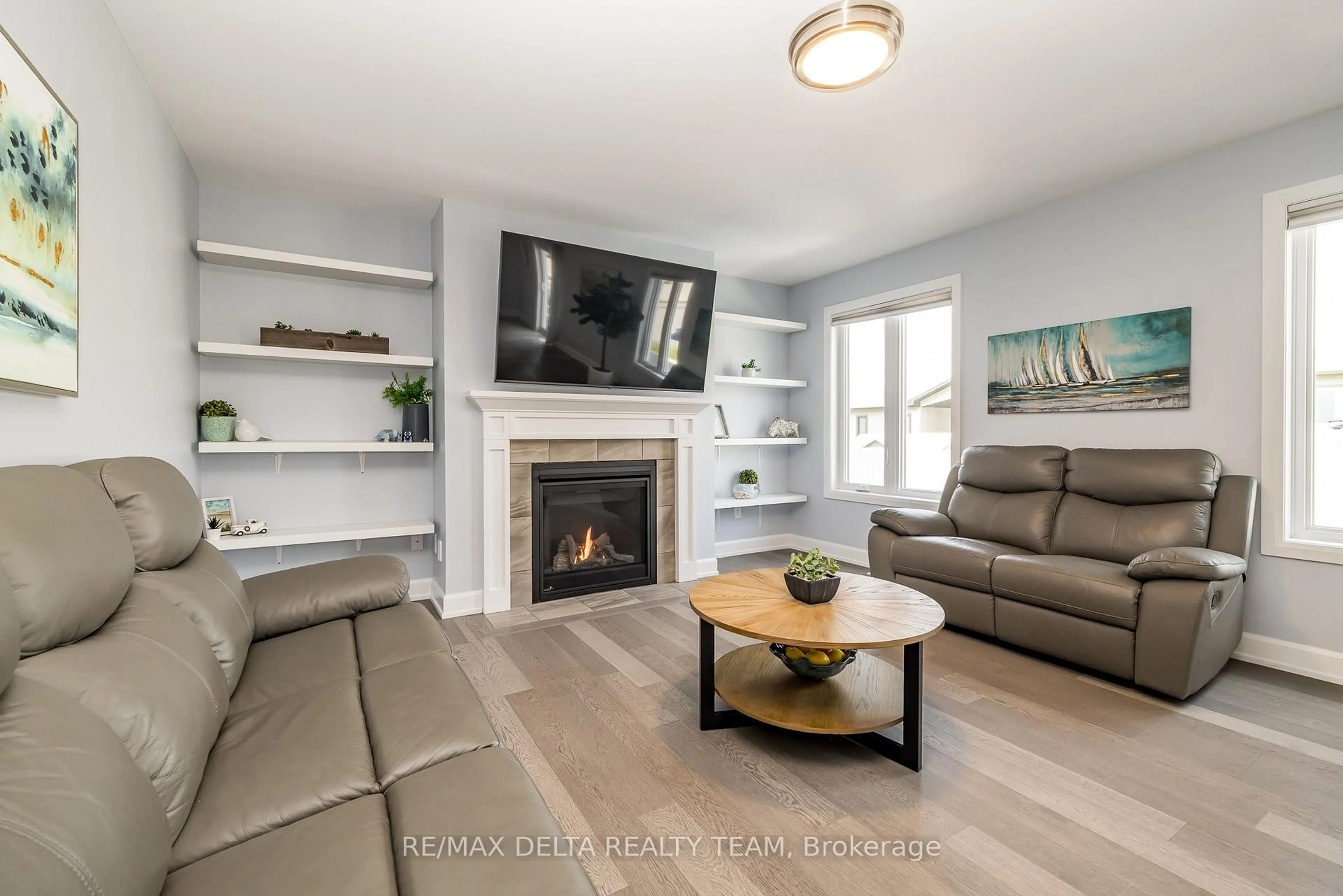 Living room with furniture, wood/laminate floor for 223 Station Tr, Russell Ontario K4R 0C9