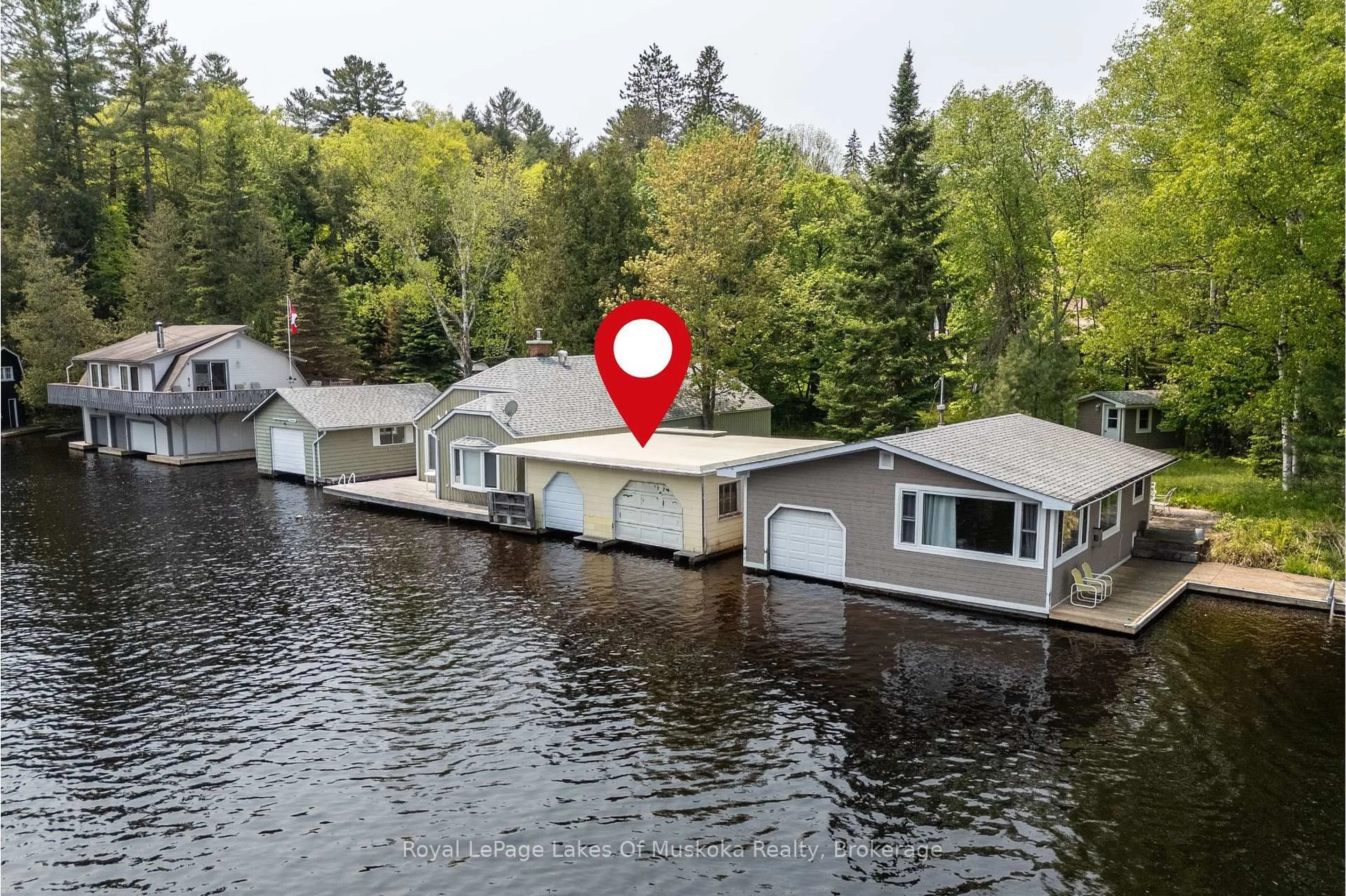 A pic from outside/outdoor area/front of a property/back of a property/a pic from drone, water/lake/river/ocean view for 675 Muskoka 10 Rd, Huntsville Ontario P0B 1L0