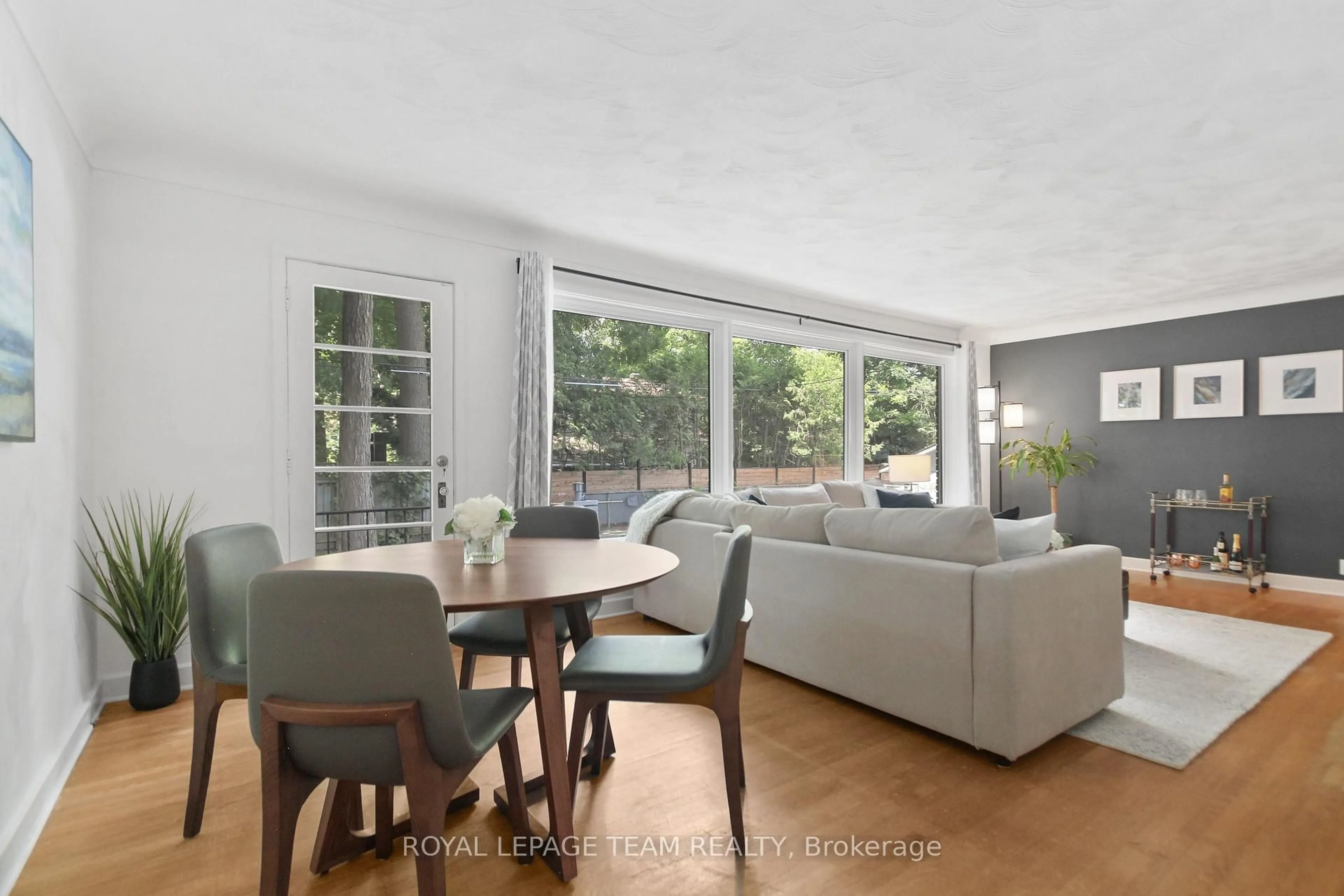 Living room with furniture, wood/laminate floor for 2176 Woodcrest Rd, Ottawa Ontario K1H 6H8