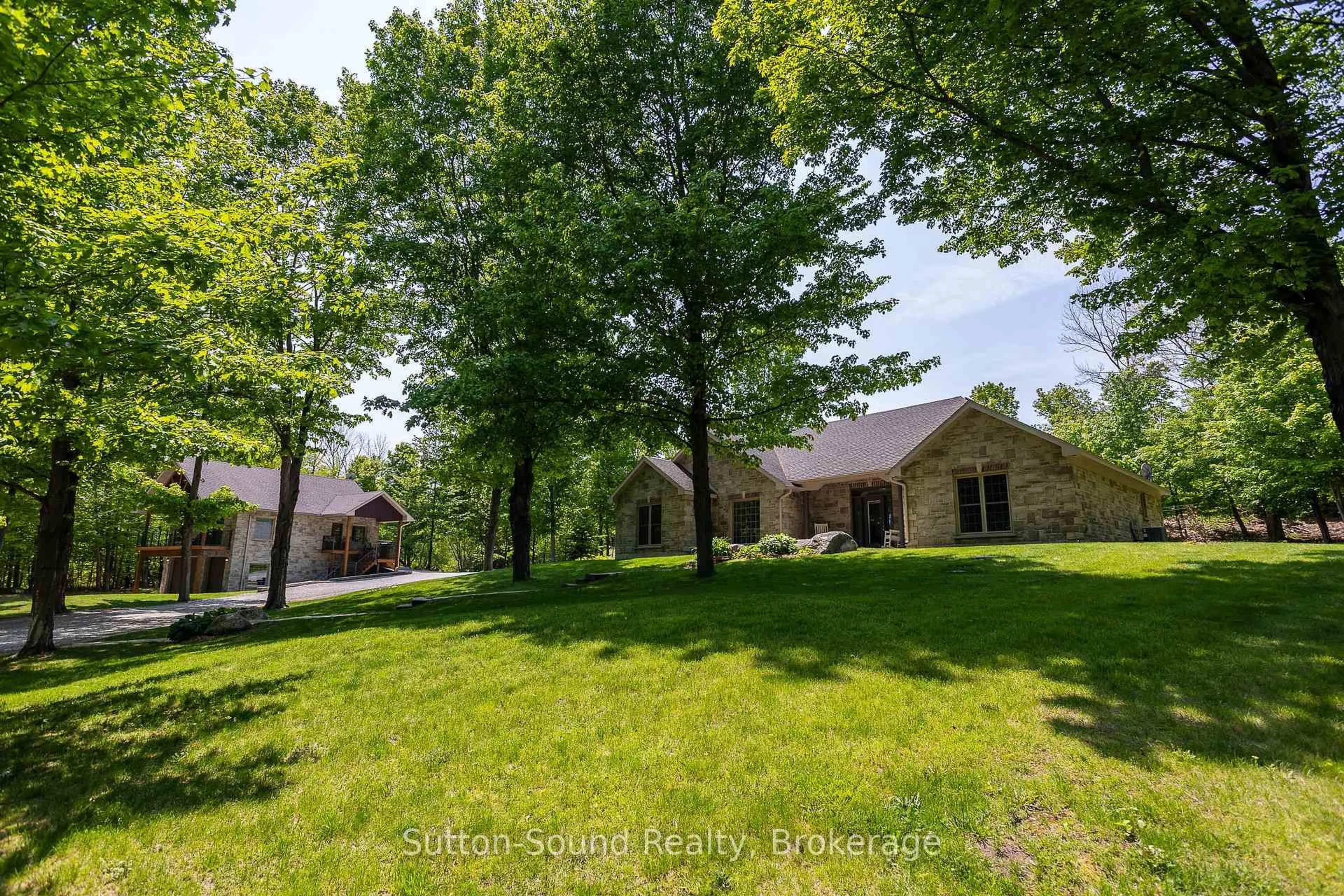 A pic from outside/outdoor area/front of a property/back of a property/a pic from drone, unknown for 505556 Grey Road 1 Rd, Georgian Bluffs Ontario N0H 1S0