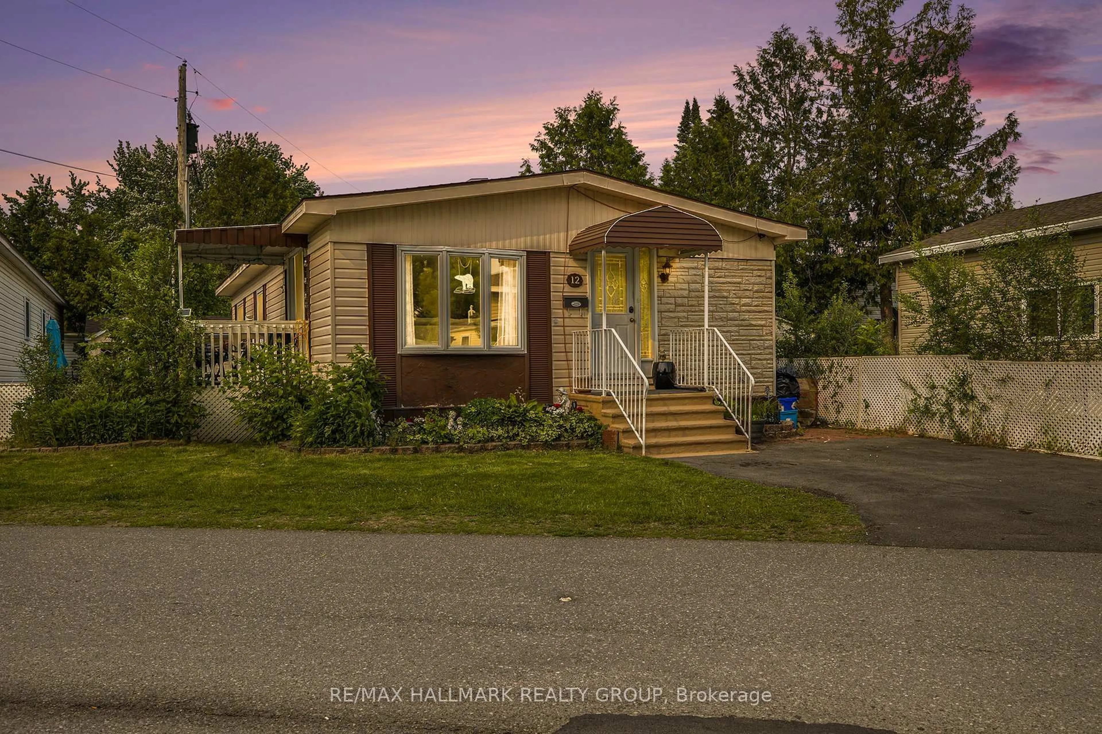 Home with vinyl exterior material, street for 12 Vanier Rd, Ottawa Ontario K2H 7P3