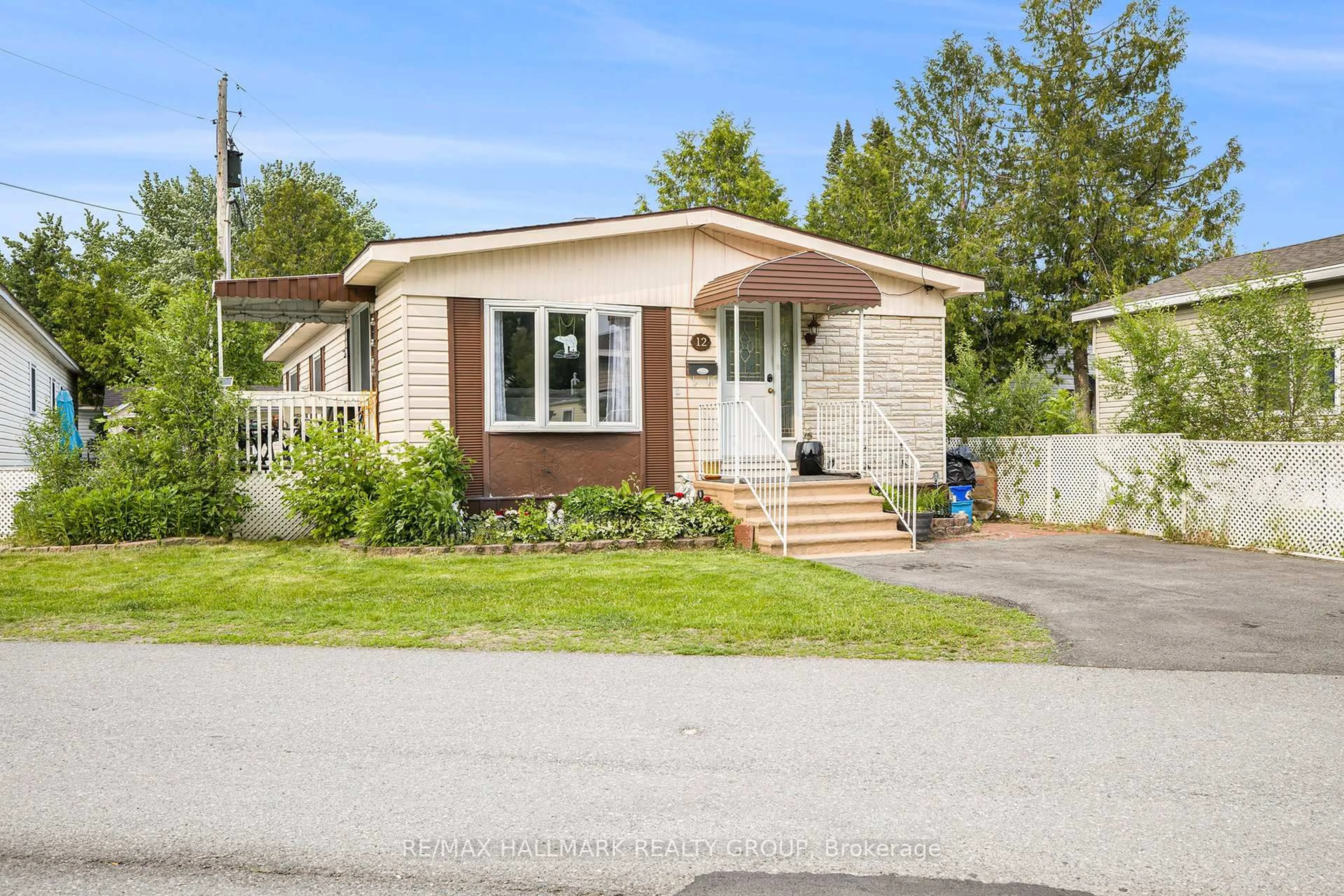 Home with vinyl exterior material, street for 12 Vanier Rd, Ottawa Ontario K2H 7P3